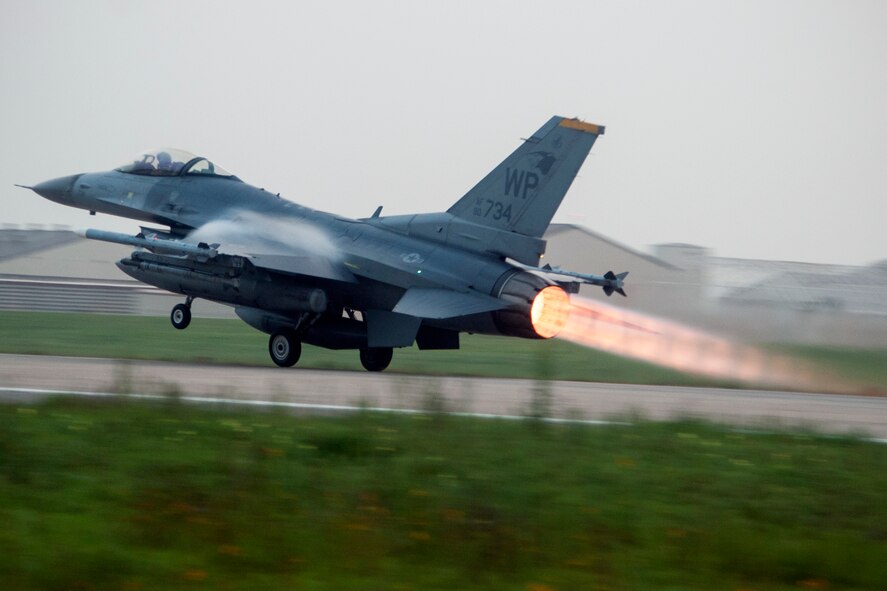 An F-16 Fighting Falcon departs from Kunsan Air Base, Republic of Korea, to attend RED FLAG-Alaska 14-3, Aug. 12, 2014. RF-A enables joint and international partners to sharpen their combat skills by flying simulated combat sorties in a realistic threat environment. These skills are vital to maintaining peace and stability in the Asia-Pacific region. (U.S. Air Force photo by Senior Airman Taylor Curry/Released)
