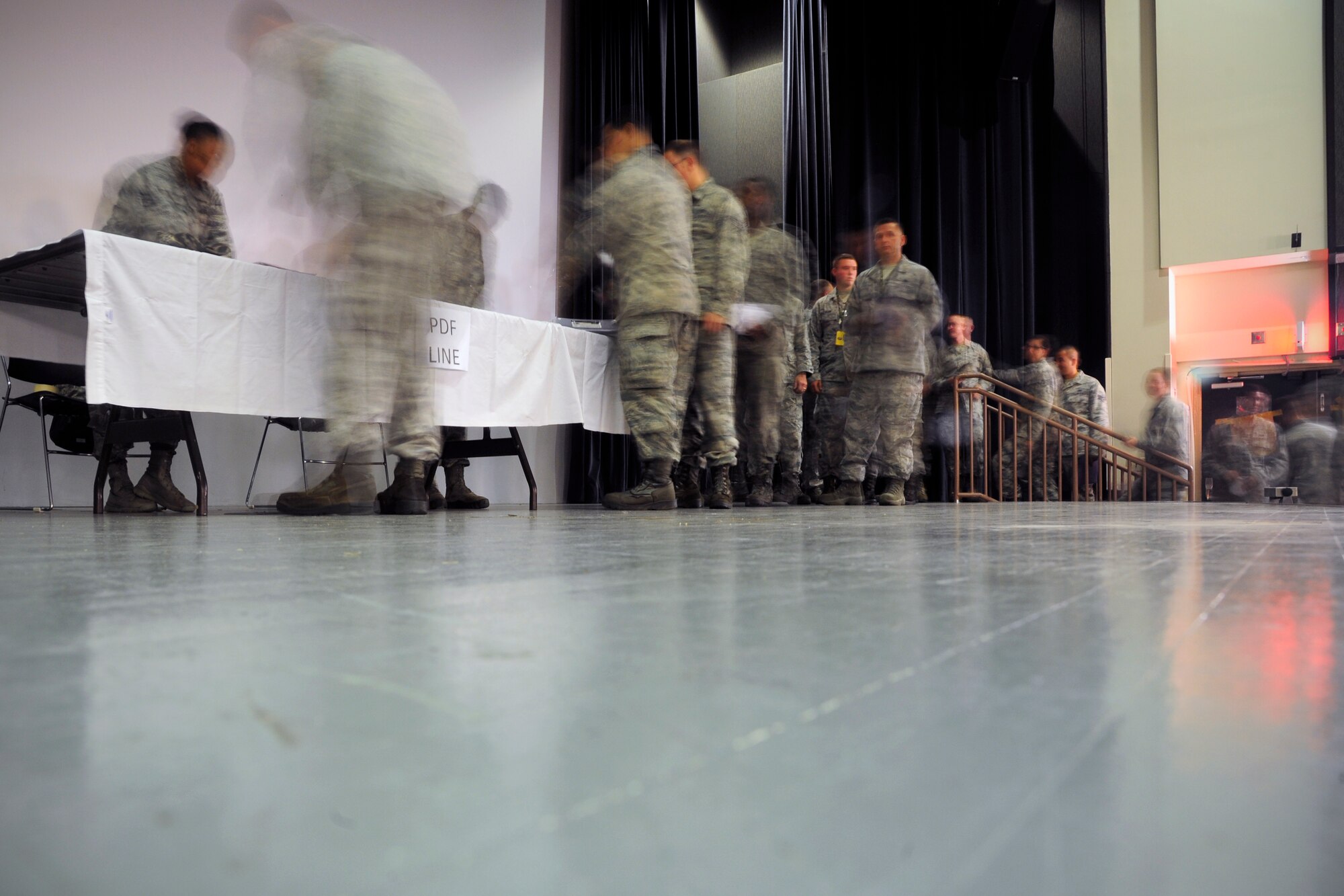 Wolf Pack Airmen outprocess before their flight to RED FLAG-Alaska 14-3, Kunsan Air Base, Republic of Korea, Aug. 5, 2014. RF-A provides realistic training for deployed maintenance and support personnel in sustainment of large-force deployed air operations.  (U.S. Air Force photo by Senior Airman Taylor Curry/Released)