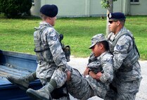 First responders assist simulated victims during an Emergency Management exercise at Kunsan Air Base, Republic of Korea, Aug. 11, 2014.  The EME was conducted to evaluate the Wolf Pack’s ability to react to a simulated emergency. (U.S. Air Force photo by Tech. Sgt. Justin Snow/Released)