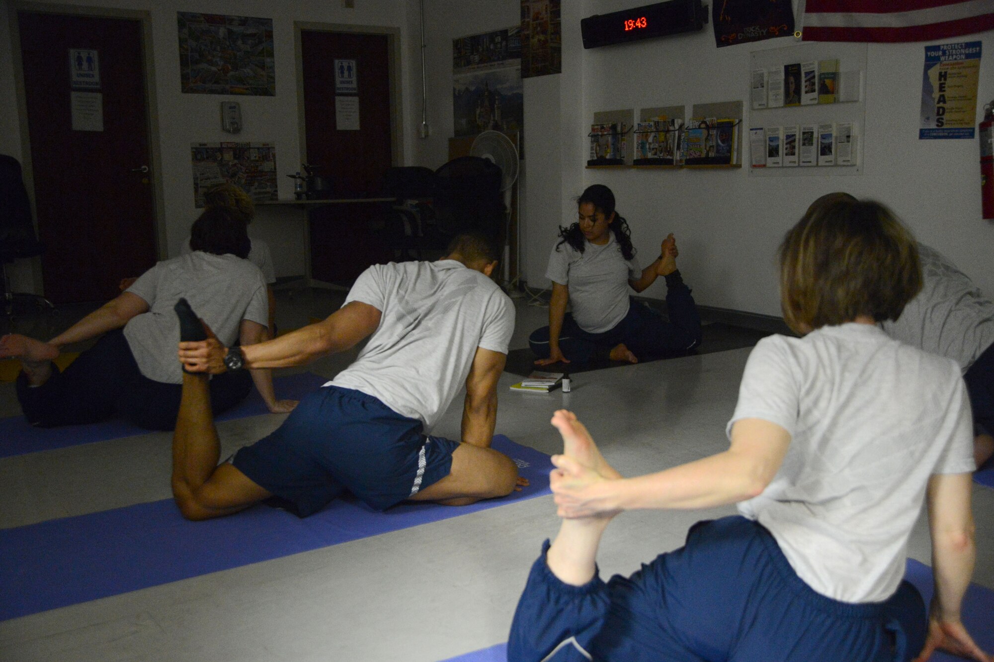 U.S. Air Force Senior Airman Kandie Ibarra, a lab technician assigned to the 455th Medical Support Squadron, Craig Joint Theater Hospital, Bagram Airfield, Afghanistan leads other healthcare professionals in a yoga class June 23, 2014.  Ibarra, a native of Blackfoot, Idaho is deployed form Keesler Air Force Base, Miss. (U.S. Air Force photo by Master Sgt. Cohen A. Young/Released)