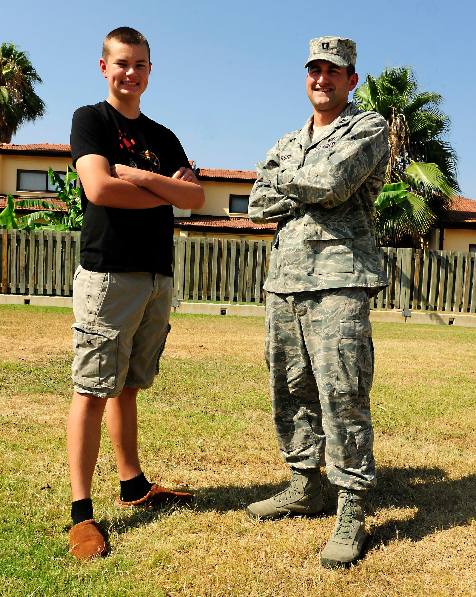 Capt. Michael Floyd, 39th Force Support Squadron manpower and personnel flight commander, stands with Danny Vaughn, III August 11, 2014, Incirlik Air Base, Turkey. Floyd helped Vaughn after a bike crash in their neighborhood. (U.S. Air Force photo by Staff Sgt. Eboni Reams/Released)