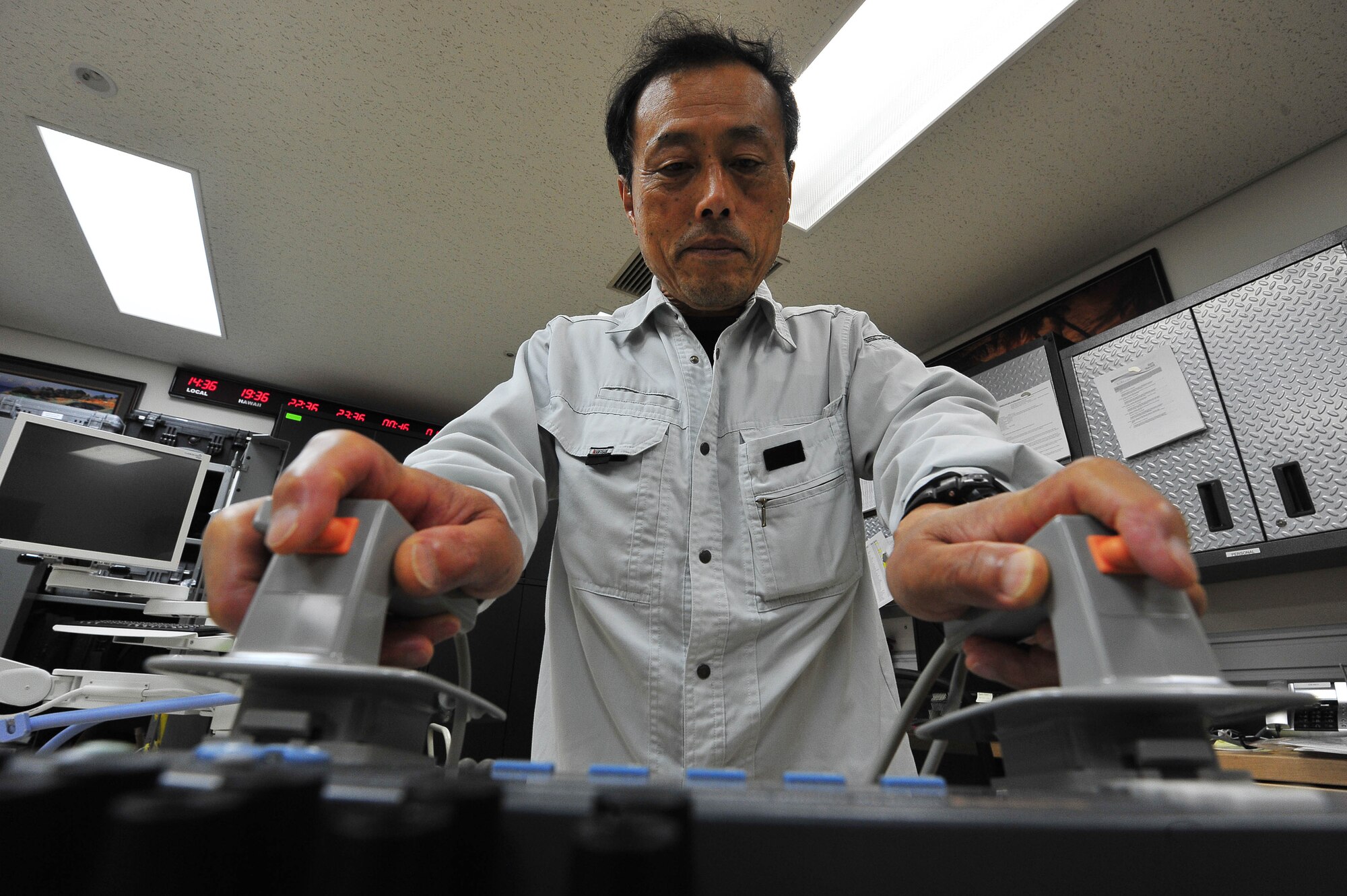 Junji Maruya, 35th Medical Support Squadron biomedical equipment technician, conducts an ops check on a defibrillator at Misawa Air Base, Japan, Aug. 1, 2014. Maruya is part of a team of BMETs specialized in repairing and servicing more than 2,000 pieces of medical equipment on base. (U.S. Air Force photo/Senior Airman Jose L. Hernandez-Domitilo)