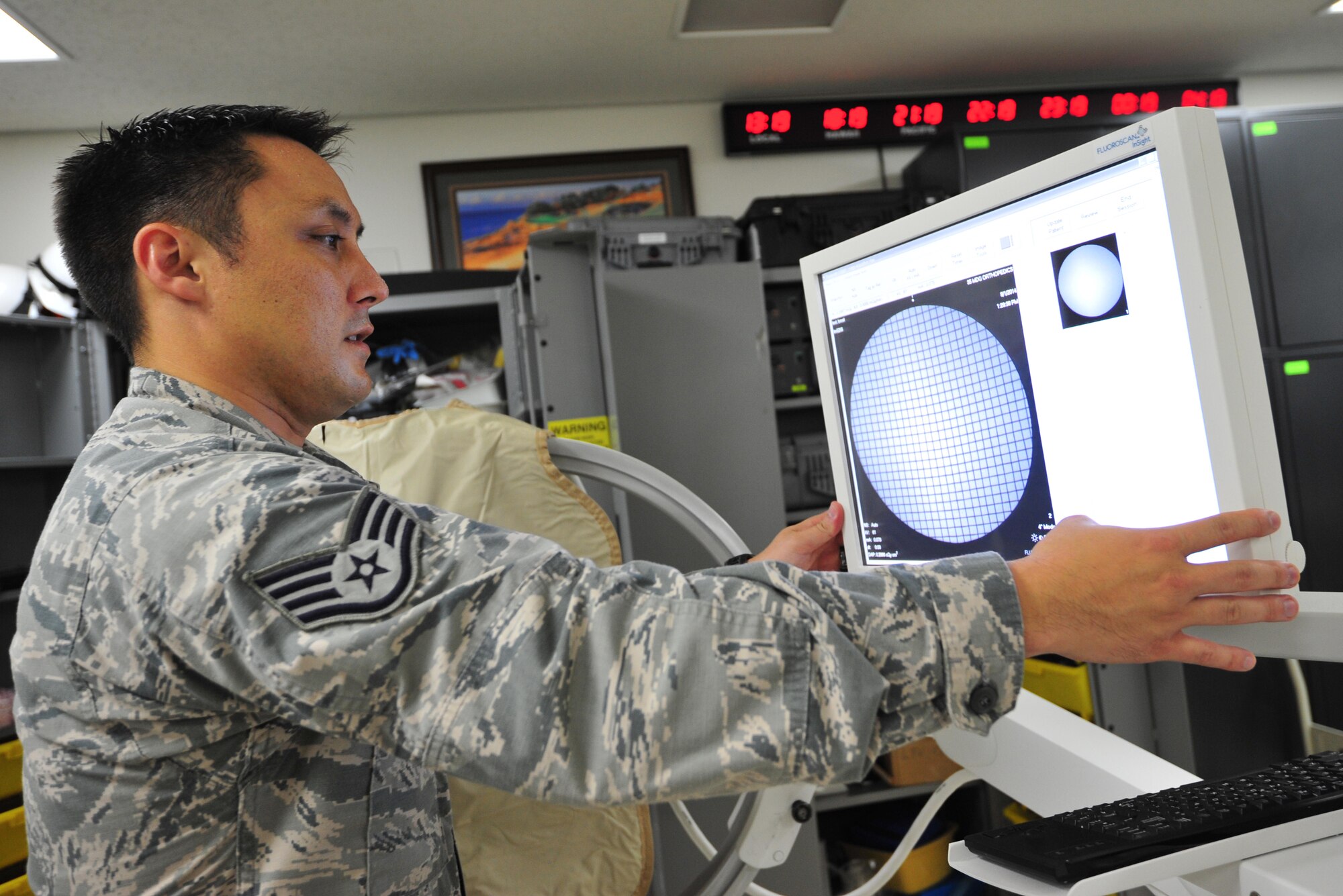 U.S. Air Force Staff Sgt. Paul Kerkman, 35th Medical Support Squadron NCO in charge of medical maintenance, checks to make sure proper calibration is exhibited on an x-ray monitor at Misawa Air Base, Japan, Aug. 1, 2014. Providers rely heavily on biomedical equipment technicians to service equipment to ensure 100 percent patient care. (U.S. Air Force photo/Senior Airman Jose L. Hernandez-Domitilo)