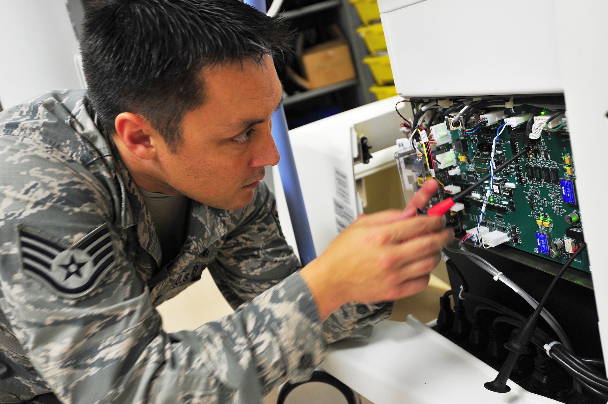 U.S. Air Force Staff Sgt. Paul Kerkman, 35th Medical Support Squadron NCO in charge of medical maintenance, attaches metering equipment onto test points on an x-ray control board at Misawa Air Base, Japan, Aug. 1, 2014. Whether it is an automated external defibrillator or an x-ray machine, Kerkman specializes in providing maintenance on a multitude of medical equipment. (U.S. Air Force photo/Senior Airman Jose L. Hernandez-Domitilo)