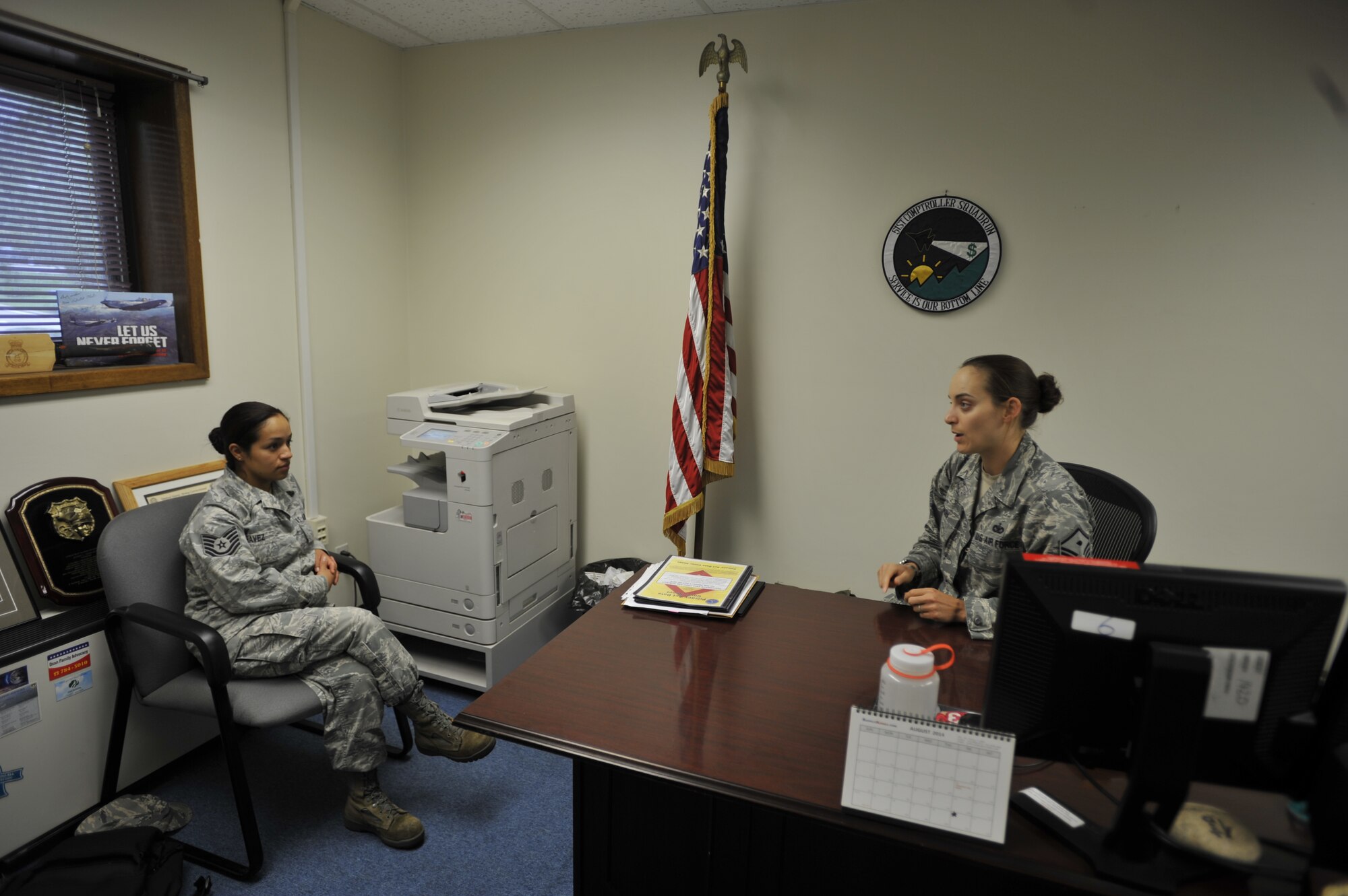 Master Sgt. Jessica McWain, 51st Fighter Wing Staff Agencies and Comptroller Squadron first sergeant, explains the different duties and responsibilities of being a first sergeant to Tech. Sgt. Alejandra Chavez, 51st FW Equal Opportunity NCO-in-charge, on Osan Air Base, Republic of Korea, Aug. 7, 2014. Chavez hopes to become a first sergeant and make a difference in the lives of her future Airmen. (U.S. Air Force photo/Senior Airman David Owsianka)