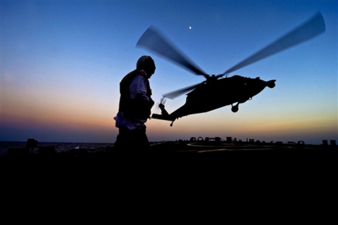 An MH-60S Seahawk helicopter takes off from the flight deck of the guided-missile destroyer USS Arleigh Burke in the Arabian Gulf, Aug. 5, 2014. The destroyer is deployed in the U.S. 5th Fleet area of responsibility supporting maritime security operations and theater security cooperation efforts. The Seahawk is assigned to Helicopter Sea Combat Squadron 26. 