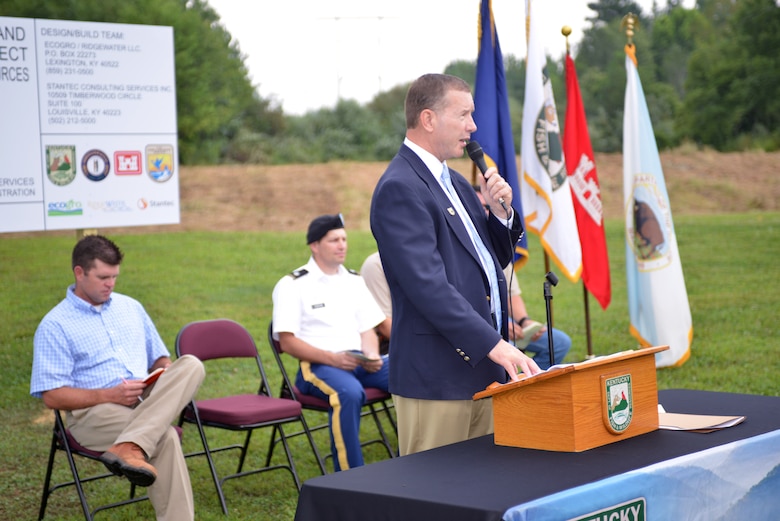 Gregory Johnson, commissioner of the Kentucky Department of Fish and Wildlife Resources speaks during a ground breaking for the Wolf Creek Hatchery Wetland and Stream Mitigation Program project below the Wolf Creek National Fish Hatchery on Aug. 8, 2014.  