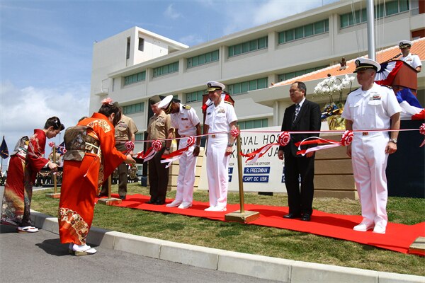 Marines, sailors and distinguished guests cut the ribbon during a ceremony signifying the opening of the U.S. Naval Hospital Okinawa on Camp Foster in 2013. The U.S. Army Engineering and Support Center, Huntsville's Medical Facilities Mandatory Center of Expertise and Standardization played a key role in the design of the new hospital and was recognized with other members of the project delivery team as the 2014 PDT of the Year for Excellence during the 2014 Strategic Leaders Conference awards dinner at Fort Belvoir, Virginia, Aug. 7.