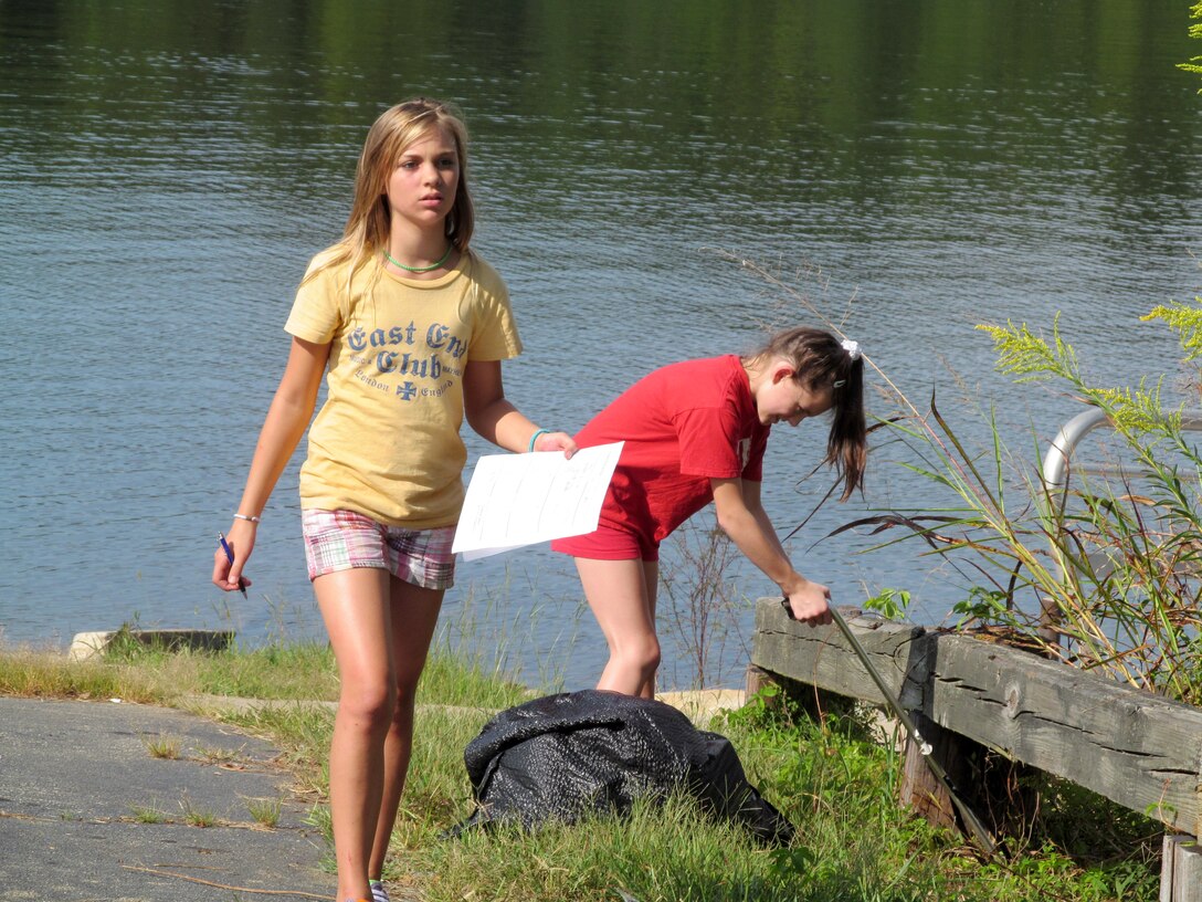 Volunteers pick up trash at Richard B. Russel Lake during the annual cleanup campaign in 2013.