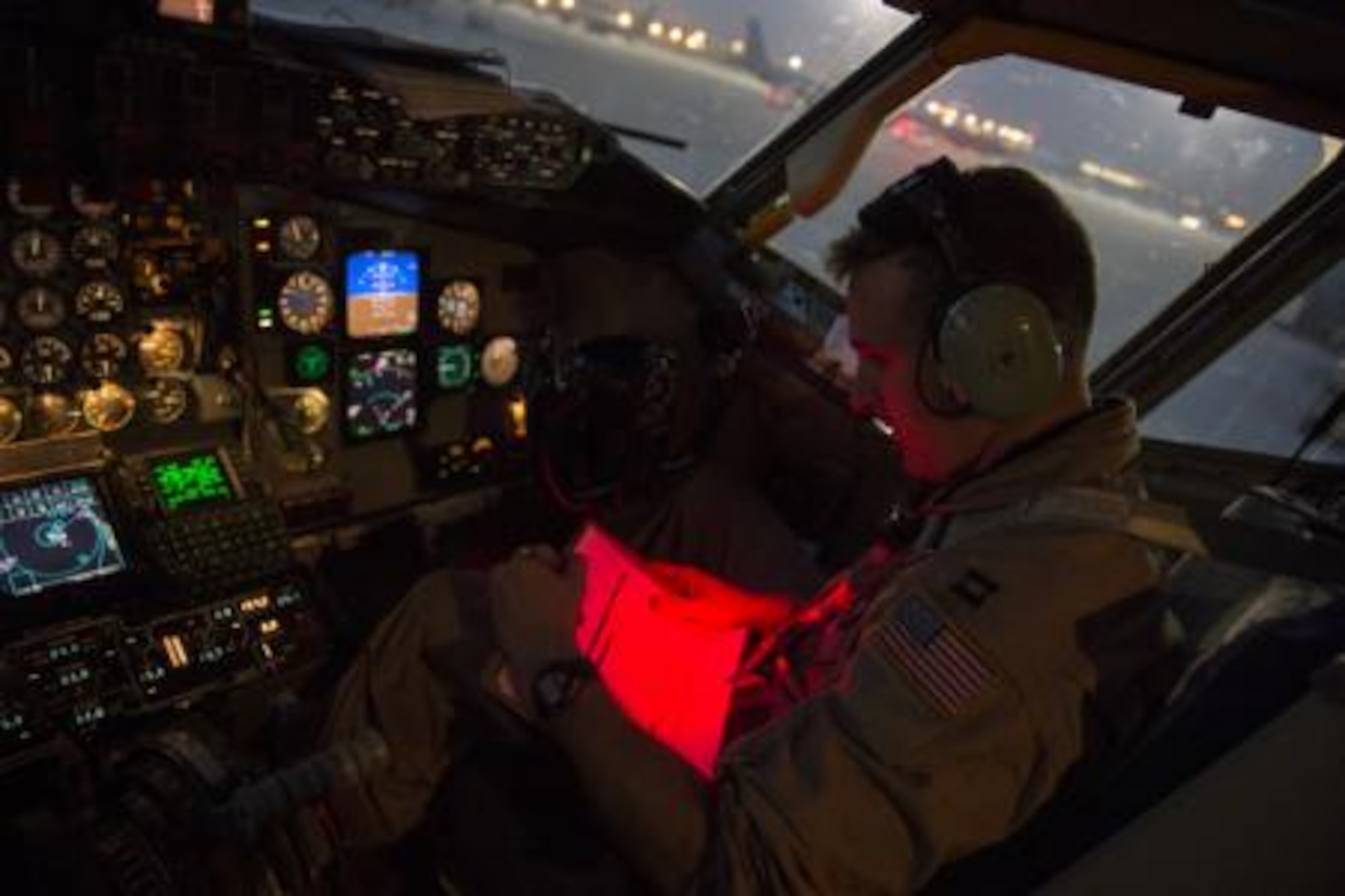 Capt. Trent Parker, 340th Expeditionary Air Refueling Squadron, KC-135 Stratotanker pilot, reads a pre-flight checklist prior to an in-air refueling mission over Iraq, Aug. 12, 2014. As the co-pilot for the mission, Parker is responsible for assisting the aircraft commander to complete the mission, takeoffs and landings. The aircrew is scheduled to offload more than 40,000 gallons of fuel to fighter aircraft completing missions in Iraq. (U.S. Air Force photo by Staff Sgt. Vernon Young Jr.)

