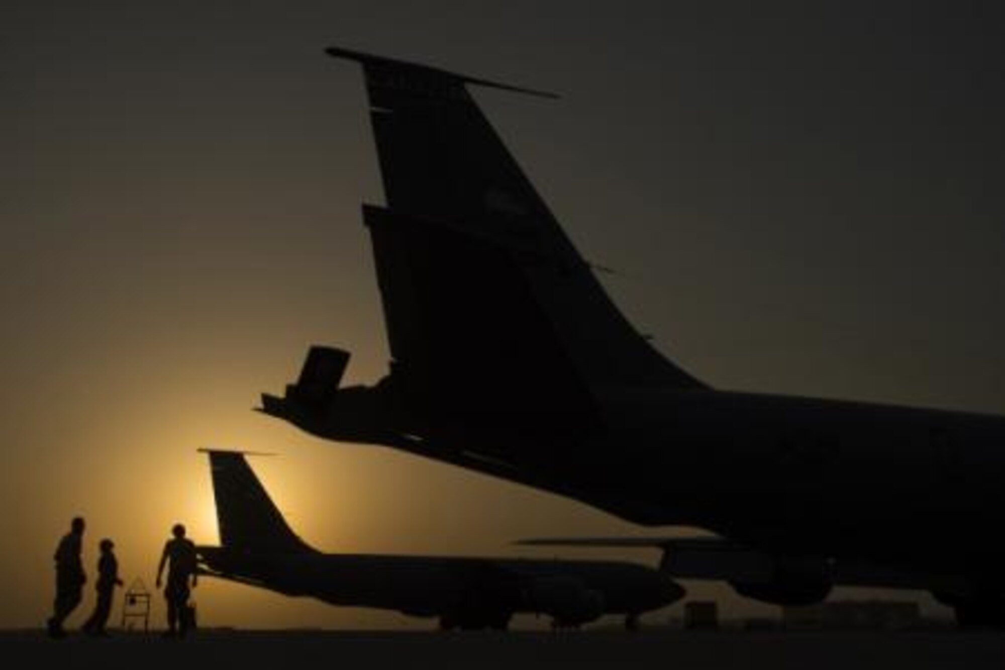 Capt. Andrea Delosreyes, 340th Expeditionary Air Refueling Squadron, KC-135 Stratotanker pilot, inspects the boom with Airman 1st Class Christopher Morgan and Jacob Manuel, 340th Expeditionary Aircraft Maintenance Squadron, KC-135 Stratotanker engine mechanics, panel prior to an in-air refueling mission over Iraq, Aug. 12, 2014. Prior to each mission, the aircraft commander does a walk-around inspection to validate the safety of the aircraft. (U.S. Air Force photo by Staff Sgt. Vernon Young Jr.)