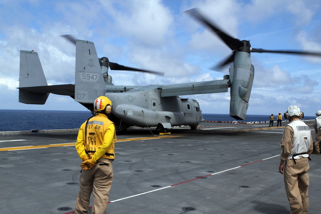 A MV-22B Osprey Jet from Marine Medium Tiltrotor Squadron 365 (Reinforced), 24th Marine Expeditionary Unit, waits to take off from the USS Iwo Jima off the coast of North Carolina, Aug. 11, 2014. The 24th MEU is taking part in Amphibious Squadron/Marine Expeditionary Unit Integration, or PMINT, the 24th MEU’s second major pre-deployment training exercise. PMINT is designed to bring Marines and Sailors from the 24th MEU and Amphibious Squadron 8 together for the first time aboard the ships of the Iwo Jima Amphibious Ready Group. (U.S. Marine Corps photo by Sgt. Devin Nichols)