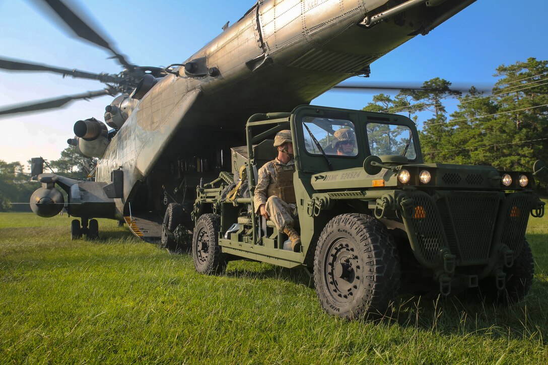 Marines with 2nd Battalion, 10th Marine Regiment, 2nd Marine Division, drive an Expeditionary Fire Support System on board a CH-53E Super Stallion to begin an aerial-assault, training mission aboard Marine Corps Base Camp Lejeune, North Carolina, July 30, 2014. The EFSS consists of an Internally Transportable-Strike Vehicle and the 120mm mortar, which is used to bridge the gap of range between 81 mm mortars and 155 mm cannons. 

