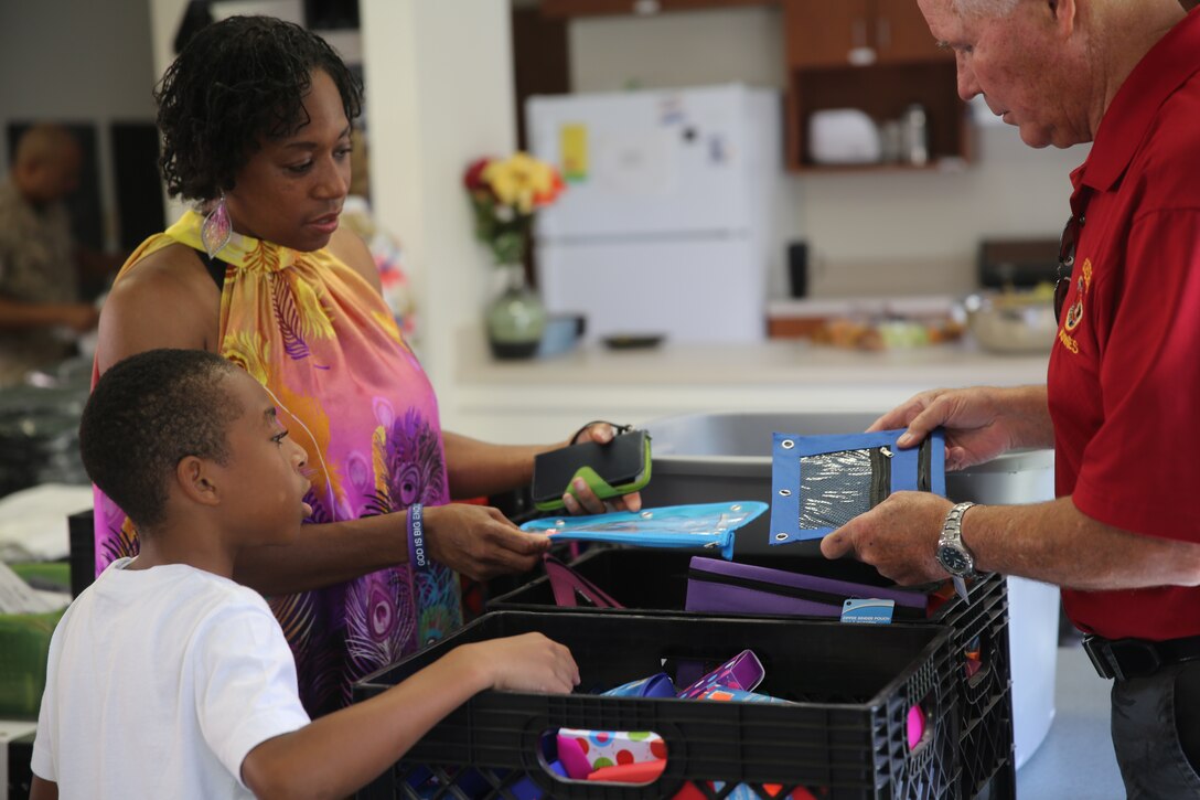 Students and their parents stock up on back to school supplies donated
to Marine Corps Logistics Base, Barstow by local stores.