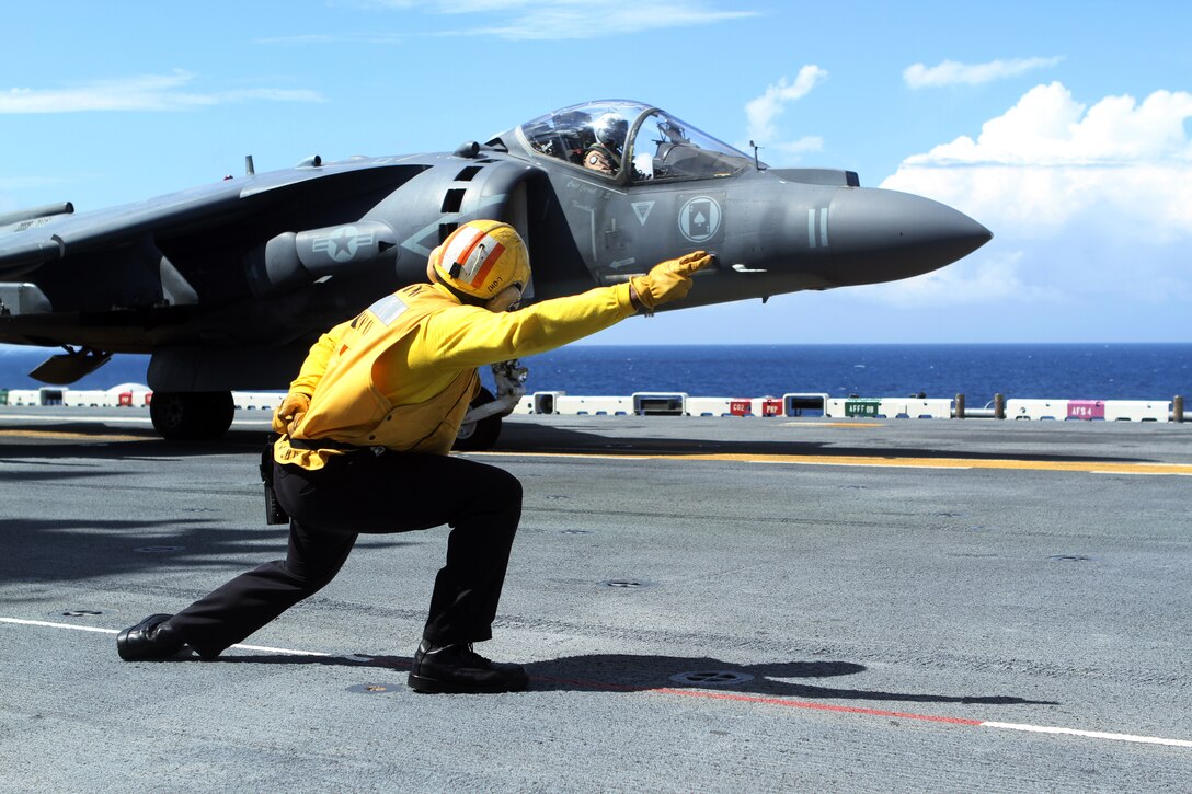 An AV-8B Harrier Jump Jet from Marine Medium Tiltrotor Squadron 365 (Reinforced), 24th Marine Expeditionary Unit, takes off from the USS Iwo Jima off the coast of North Carolina, Aug. 11, 2014. The 24th MEU is taking part in Amphibious Squadron/Marine Expeditionary Unit Integration, or PMINT, the 24th MEU’s second major pre-deployment training exercise. PMINT is designed to bring Marines and sailors from the 24th MEU and Amphibious Squadron 8 together for the first time aboard the ships of the Iwo Jima Amphibious Ready Group. 