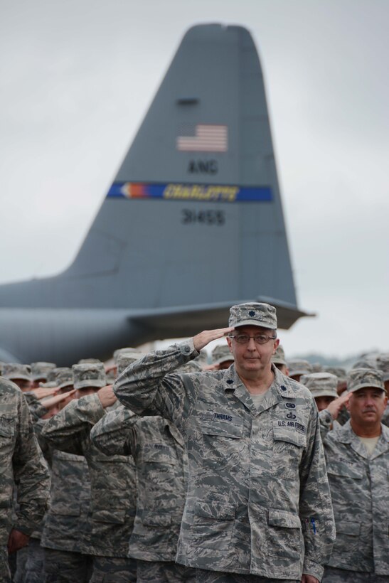 U.S. Air Force Lt. Col. David Thrams, 145th Maintenance Group commander, North Carolina Air National Guard, reports all troops present and accounted for during a recent ramp formation held at the North Carolina Air National Guard base, Charlotte Douglas Int’l. airport, Aug. 2, 2014. (U.S. Air National Guard photo by Tech. Sgt. Rich Kerner/Released)