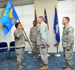 U.S. Air Force Lt. Col. Gregory J. Walters relinquishes command of the 145th Civil Engineer Squadron by passing the guidon to Col. Barbara G. Doncaster, 145th Mission Support Group commander, during a Change of Command ceremony held at the North Carolina Air National Guard base, Charlotte Douglas Intl. airport, June 7, 2014. Walters, who took command of 145th CES in December 2010, retires after 28 years of honorable service. (U.S. Air National Guard photo by Master Sgt. Patricia F. Moran, 145th Public Affairs/Released)