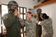 Colombian Air Force Brig. Gen. Carlos Eduardo Bueno and Brig. Gen. Ramses Rueda Rueda (sic) are fitted with flight helmets by U.S. Air Force Tech. Sgt. Hannah Conner and Tech. Sgt. Benita Johnson, both assigned to the 169th Operations Support Squadron's Aircrew Flight Equipment section from McEntire Joint National Guard Base of the South Carolina Air National Guard, Aug. 11, 2014. The fitting is part of the preflight requirements to fly in a SCANG F-16 during Relampago (Lightning) 2014, at Rionegro, Colombia. Relampago is a combined air cooperation engagement with the Republic of Colombia. One hundred Airmen and six F-16s are participating in the first major joint-air training opportunity under the auspices of the South Carolina National Guard's State Partnership Program with the country of Colombia. (U.S. Air National Guard photo by Tech. Sgt. Jorge Intriago/Released)