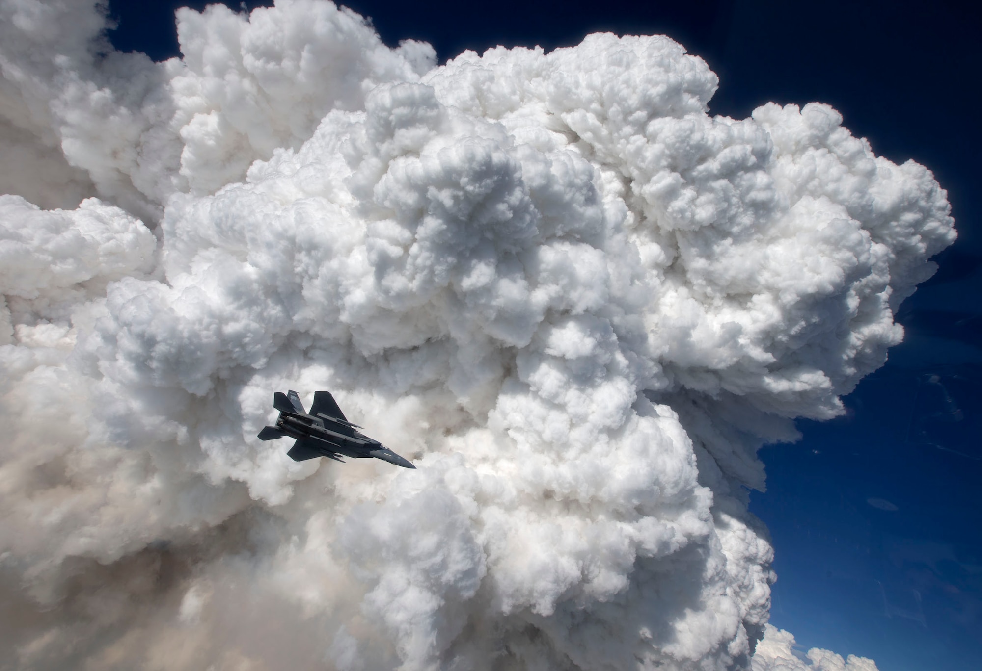 Oregon Air National Guard F-15 Eagles from the 173rd Fighter Wing fly over the wildland fires in Southern Ore. following a routine training mission.  The 173rd Fighter Wing is home to the premiere F-15C schoolhouse for the United States Air Force.  (Photo courtesy of Jim "Hazy" Hazeltine, High-G Productions) RELEASED