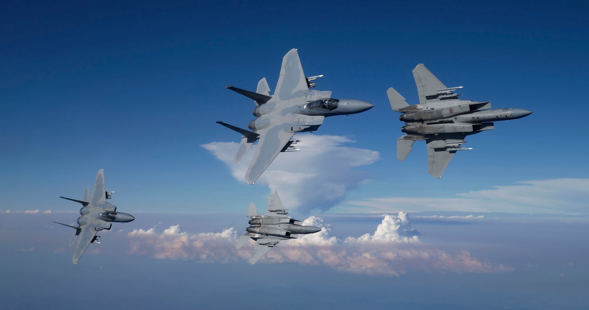 Oregon Air National Guard F-15 Eagles from the 173rd Fighter Wing fly over the wildland fires in Southern Ore. following a routine training mission.  The 173rd Fighter Wing is home to the premiere F-15C schoolhouse for the United States Air Force.  (Photo courtesy of Jim "Hazy" Hazeltine, High-G Productions) RELEASED