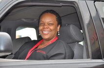 Senior Airman Thelma Smith cries tears of joy as she sits in her 2001 Ford Explorer for the first time after receiving it from the Cars 4 Heroes organization at an event held at the Bi-Lo Country Mart in Warrensburg, Mo., Friday. (U.S. Air Force photo by 1st Lt. Jeff Kelly/Released)