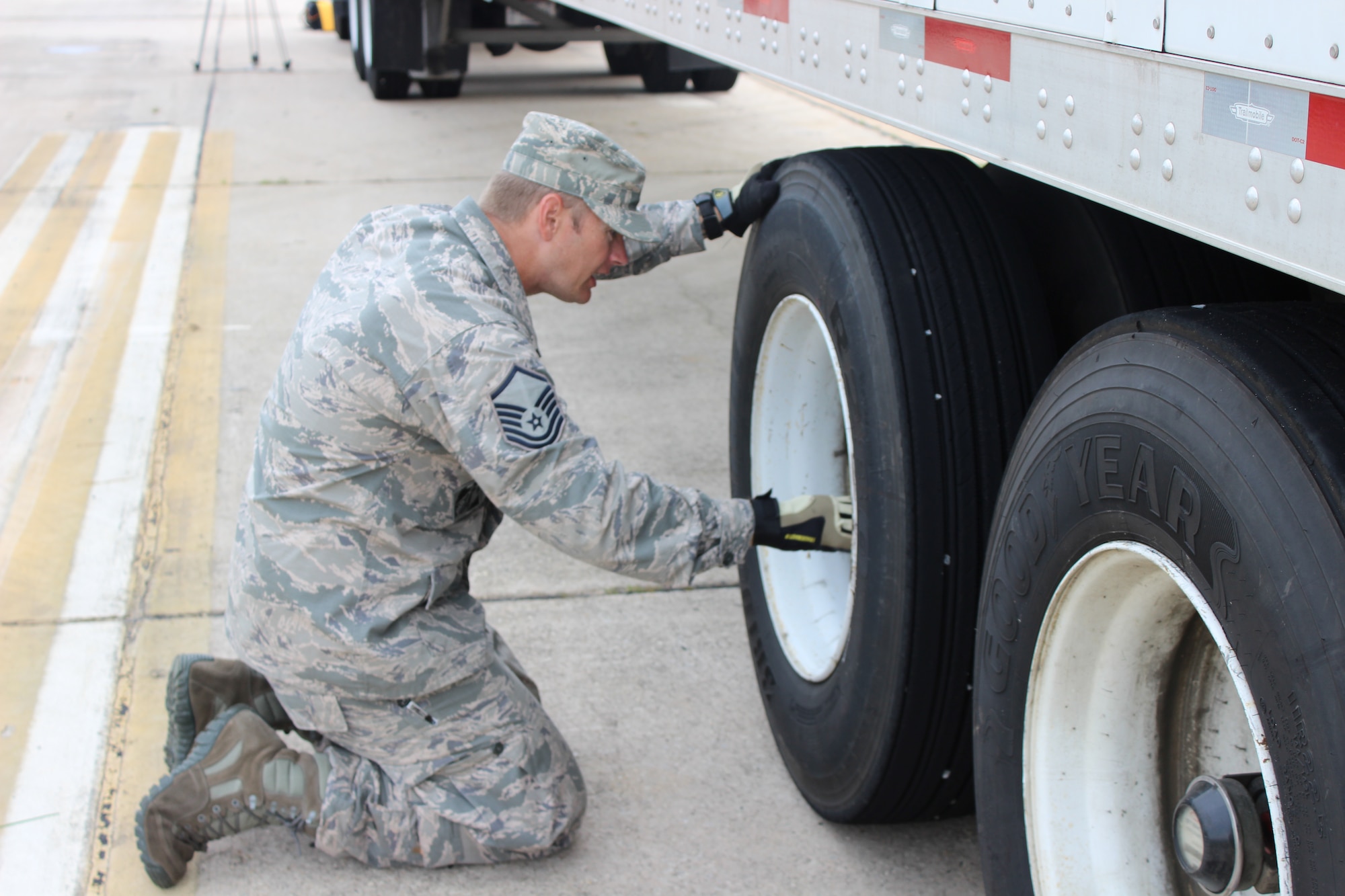 Master Sgt. Michael Mabe goes through a pre-trip inspection on his tractor trailer at Dobbins Air Reserve Base, Ga. Mabe was a student in the tractor trailer training class at the Expeditionary Combat Support-Training Certification Center at Dobbins. The classes are conducted on a “dead runway” on base which is used for a multitude of various training courses. (U.S. Air Force Photo/Released)