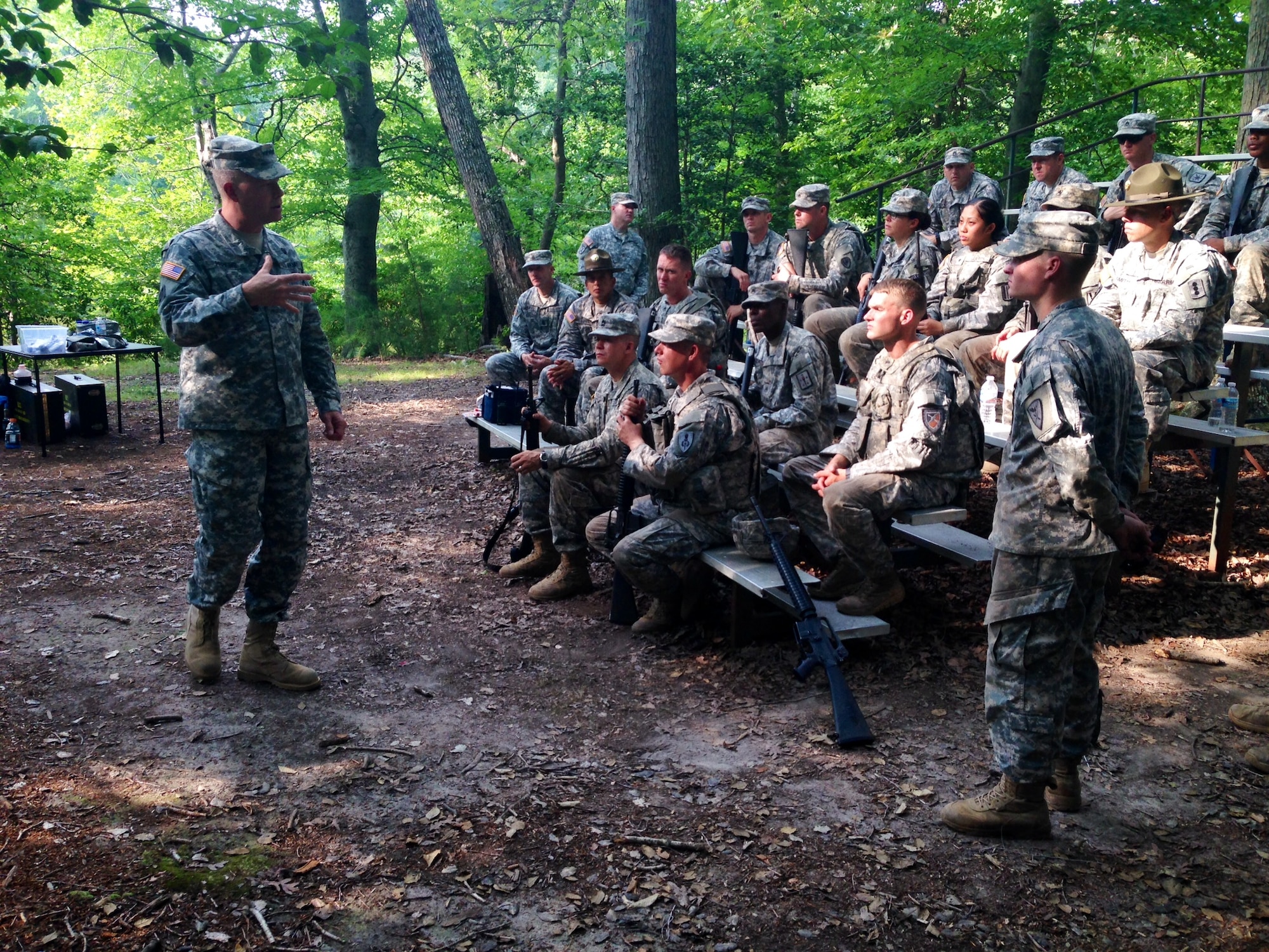 U.S. Army Gen. David G. Perkins, commanding general of U.S. Army Training and Doctrine Command, spoke with TRADOC Noncommissioned Officer and Soldier of the Year competitors at Fort Eustis, Va., Aug. 6, 2014. The competition was designed to be mentally and physically challenging, packed with various tasks ranging from a 12-mile road march to a “stress shoot.” (U.S. Army photo by Sgt. Maj. Jose Velazquez/Released)
