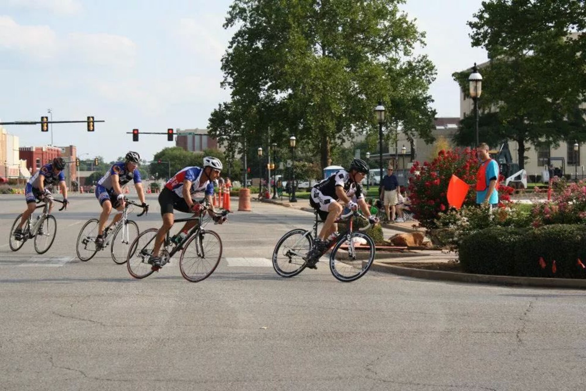 (Second from right) 2nd Lt. Matt Bell, a student pilot in the 3rd Flying Training Squadron, rounds a corner during the 2013 Twilight Criterium race in the Tour de Trykes. Seven Team Vance members plan to race in several 2014 Tour events. Members interested in cheering on Bell and other Airmen can find them in the red, white and blue uniforms worn by all Vance Cycling Team members. The races are Aug. 16. (U.S. Air Force Courtesy photo)