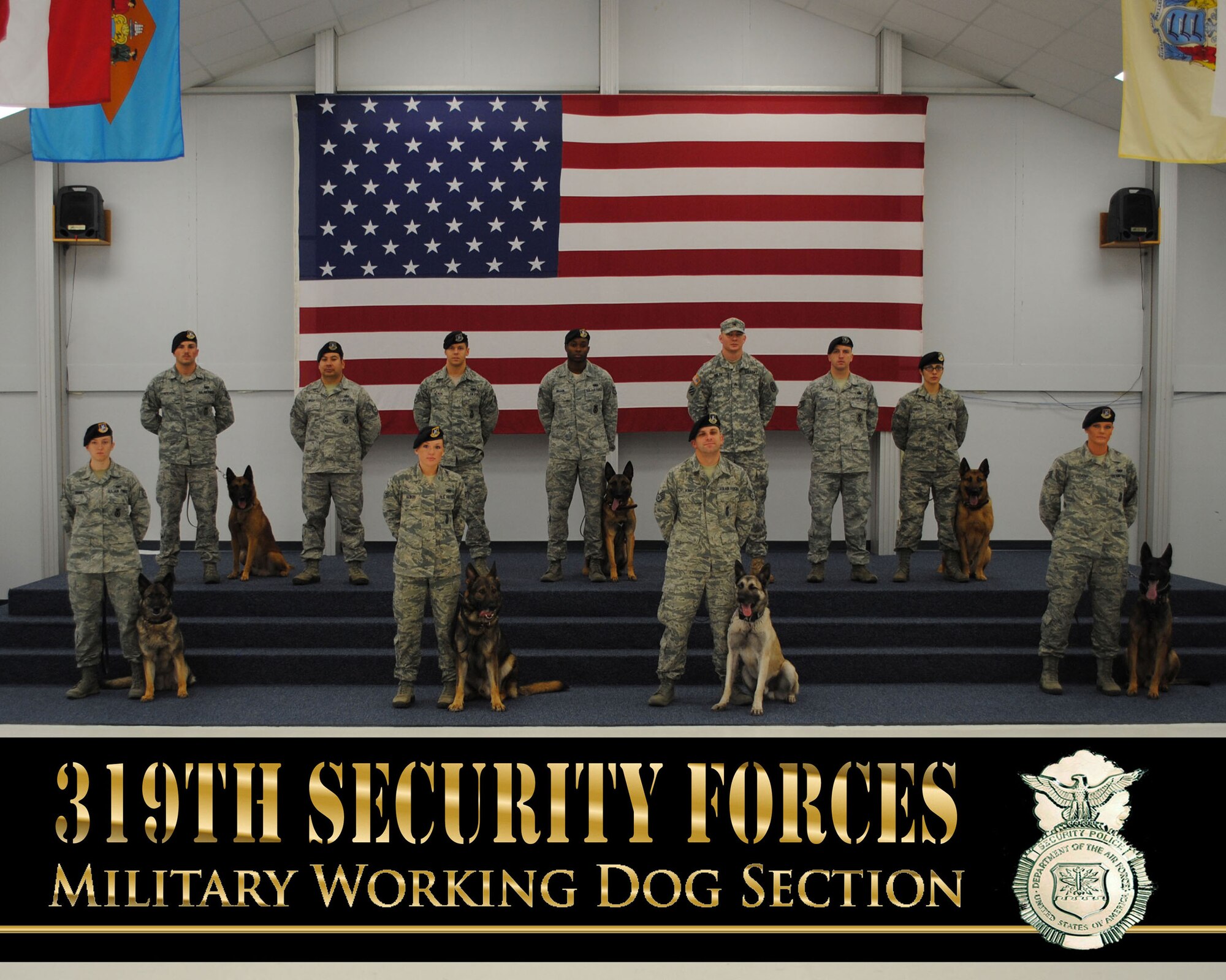 Handlers and K9s from the 319th Security Forces Squadron Military Working Dog Section pose for a group photo Nov. 12, 2013, at the Grand Forks Air Force Base Honor Guard Building on Grand Forks AFB, N.D. The 319th SFS handlers and MWDs dominated two of the three portions of a  K9 Challenge that included K9 teams from around the northern state and took place Aug. 12, 2014 in the city of Grand Forks, N.D.   (U.S. Air Force photo illustration/Staff Sgt. Luis Loza Gutierrez)