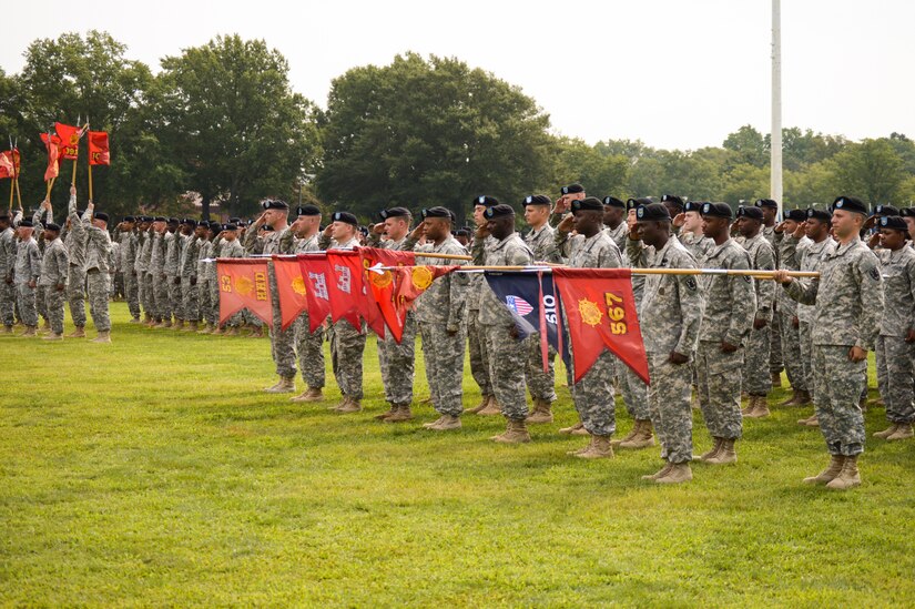 U.S. Army Soldiers render salutes during the 7th Transportation Brigade (Expeditionary) change of responsibility ceremony at Fort Eustis, Va., Aug. 8, 2014. During the ceremony, Command Sgt. Maj. Tony Escalona relinquished command of the 7th Trans. Bde. (Ex.) to Command Sgt. Maj. Vickie Culp. (U.S. Army photo by Spc. Marian Alleva/Released)