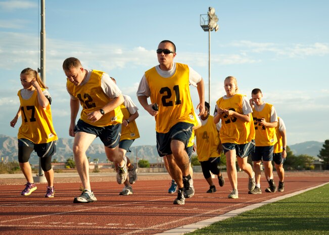 Airmen from Nellis Air Force Base begin the 1.5-mile timed run of the Air Force fitness assessment at the Warrior Fitness Center, Nellis AFB, Nev., Aug. 11, 2014. Airmen who maintain high fitness standards and achieve a cumulative score of 90 or more are only required to take the fitness assessment once a year. (U.S. Air Force photo by Senior Airman Timothy Young)