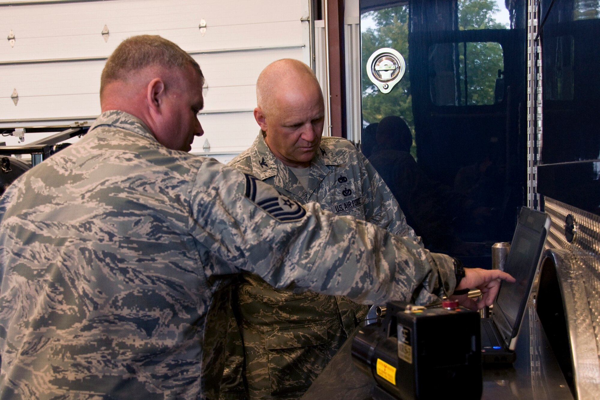 GRISSOM AIR RESERVE BASE, Ind. -- Senior Master Sgt. Scott Fleek, 434th Civil Engineer Squadron explosives ordnance disposal flight superintendent , demonstrates to Col. Mark Pantone, 4th Air Force director of logistics and installations, how portable X-ray technology can be used to determine the composition of various explosive threats to help render them safe during the colonel?s visit to Grissom Air Reserve Base, Ind., Aug. 10, 2014. During the two-day visit, Pantone met with to discuss issues and identify opportunities and challenges affecting the 434th Air Refueling Wing. (U.S. Air Force photo/Staff Sgt. Ben Mota)