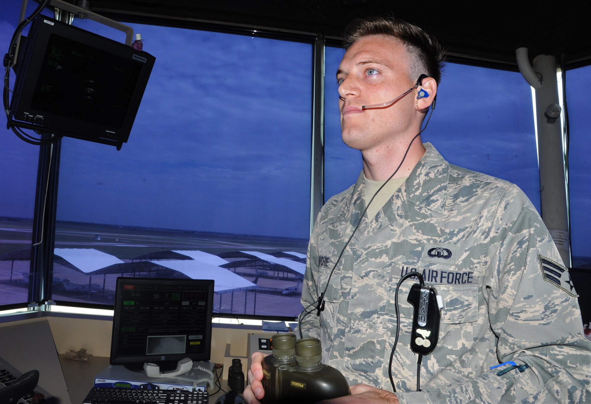 Senior Airman Wesley Ritchie, a 71st Operations Support Squadron air traffic controller, watches for aircraft in the air traffic control tower. Richie is the 71st Flying Training Wing Airman of the Month for July. (U.S. Air Force photo/Senior Airman Frank Casciotta)