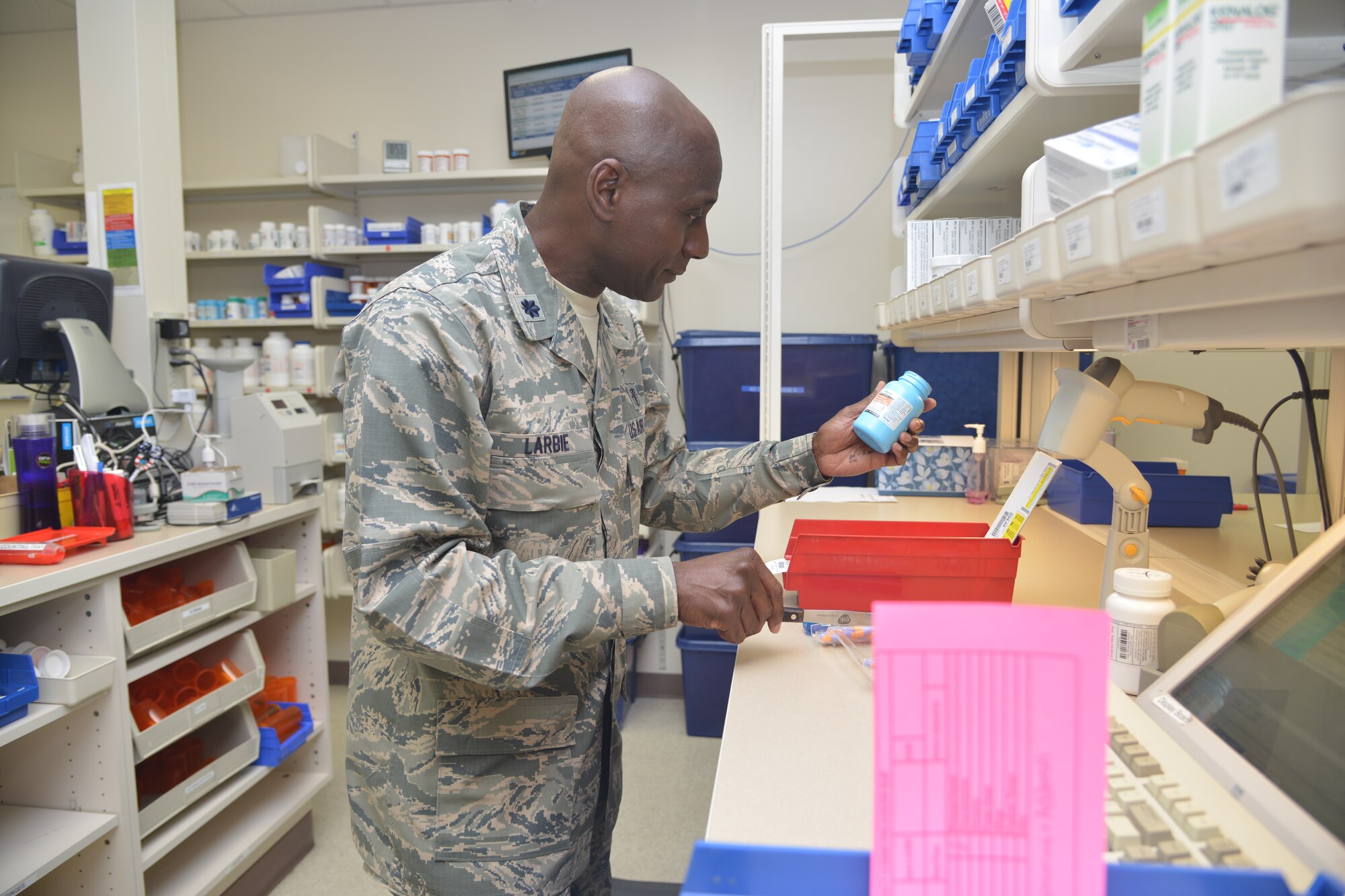 Lt. Col. Derek Larbie, flight commander of the 377th Medical Group's pharmacy, created a more efficient process for filling prescriptions safely. Larbie received the American Hospital Association’s 2013 Federal Health Care Executive Special Achievement Award. (Photo by Todd Berenger)