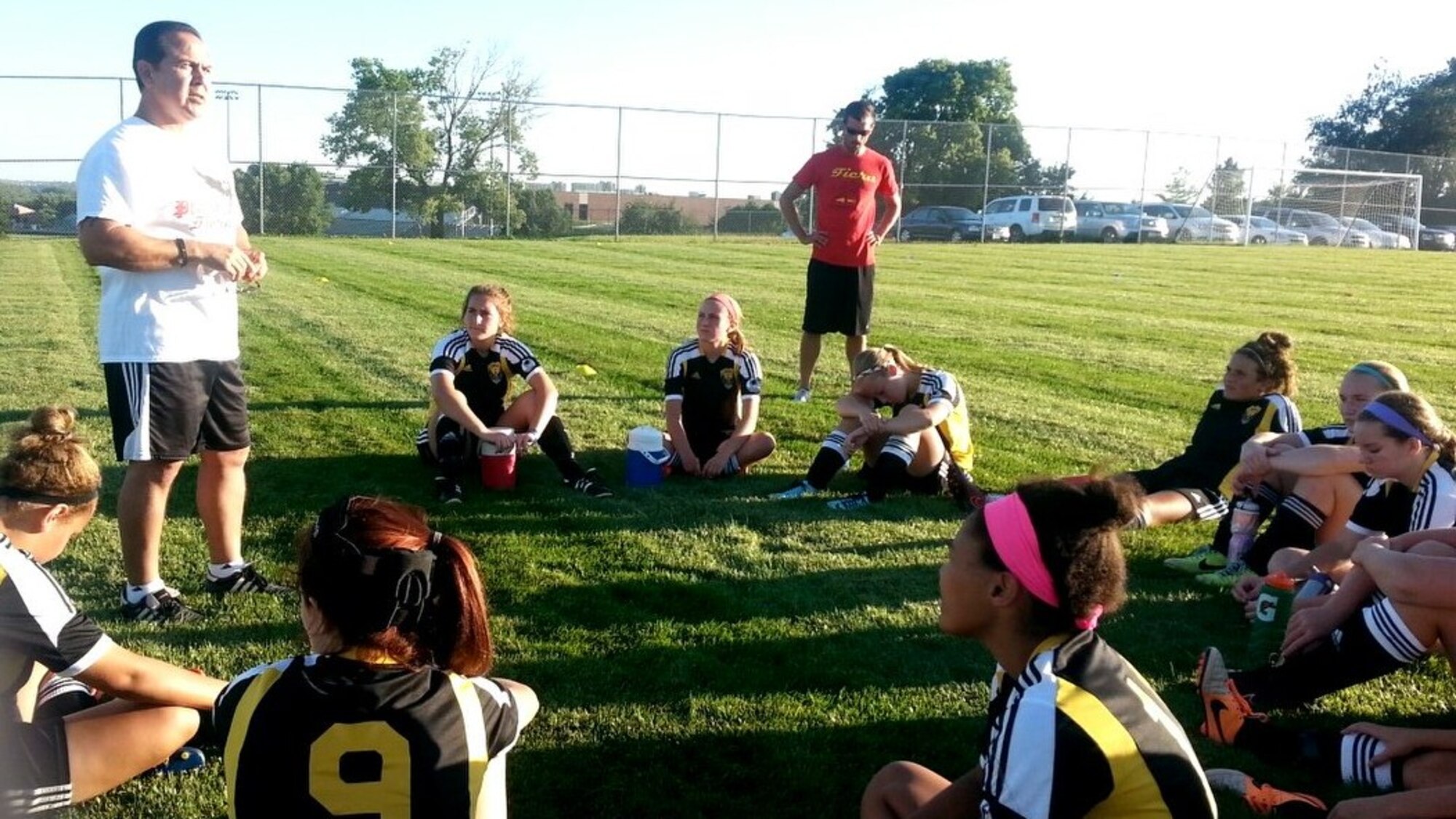 Retired U.S. Air Force Master Sgt. Richard Esparza, 55th Medical Group medical readiness manager, delivers a half-time speech to his under-15 girls premier team, Fiera, during a recent game. Esparza has been coaching soccer for nearly two decades. (U.S. Air Force courtesy photo)