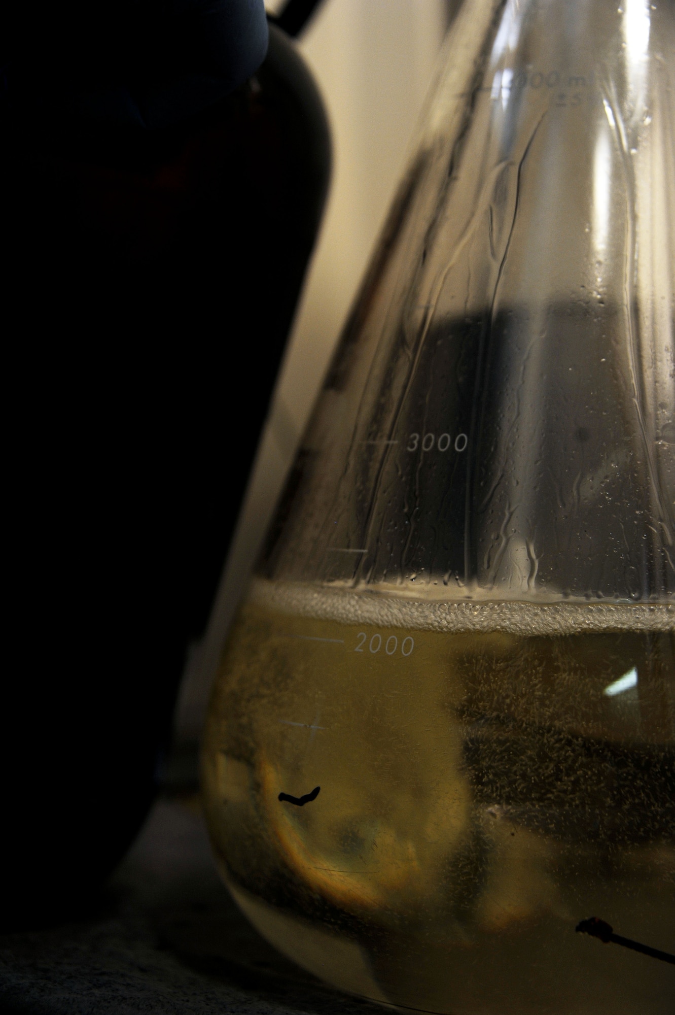 Fuel passing through a filter and into a container at the fuels lab at Maxwell Air Force Base Ala., Aug. 6, 2014. The Jet A1 fuel was being tested for water and sediment content.(U.S Air Force photo/Airman 1st Class Alexa N. Culbert)