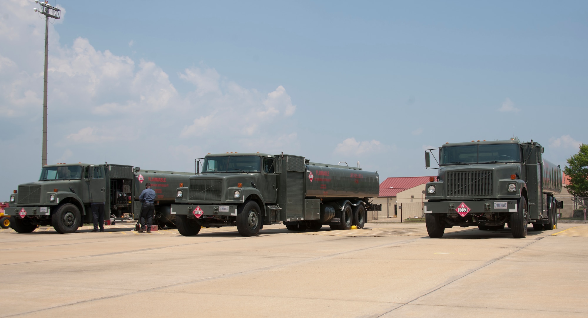 John Brown, a fuels lab supervisor and assistant manager from the 42nd Logistics and Readiness Squadron Fuels, extracts fuel from one of four tank trucks for testing purposes at Maxwell Air Force Base Ala., Aug. 6, 2014. Brown was testing for excessive amounts of water and sediments in the fuel. (U.S Air Force photo/Airman 1st Class Alexa N. Culbert)