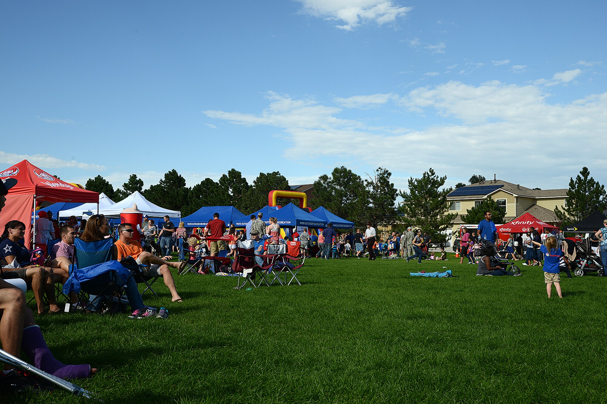 PETERSON AIR FORCE BASE, Colo. — Families participate in activities during the annual Family Festival and Concert held at Patriot Park Aug. 8. The event was open to all base personnel and their families and included food, beverages, inflatables, old fashioned games and live music. (U.S. Air Force photo/Airman 1st Class Rose Gudex)