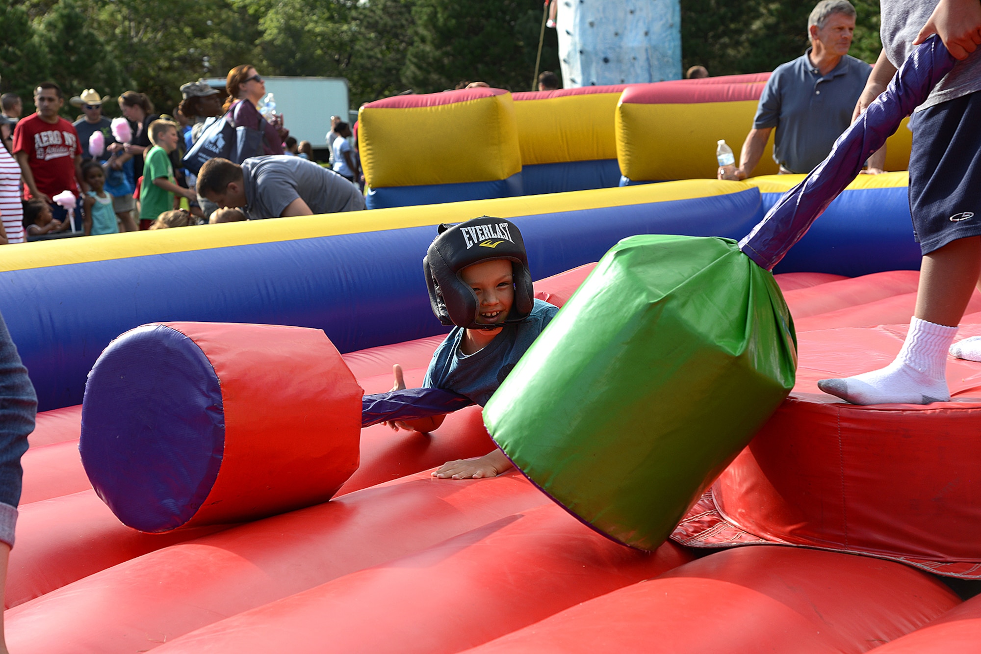 PETERSON AIR FORCE BASE, Colo. — Andrew Salvador, 8, put up a good fight on one of the inflatable games at the annual Family Festival and Concert hosted by the 21st Force Support Squadron at Patriot Park Aug. 8. The event was open to all base personnel and their families and included food, beverages, inflatables, old fashioned games and live music. (U.S. Air Force photo/Airman 1st Class Rose Gudex)