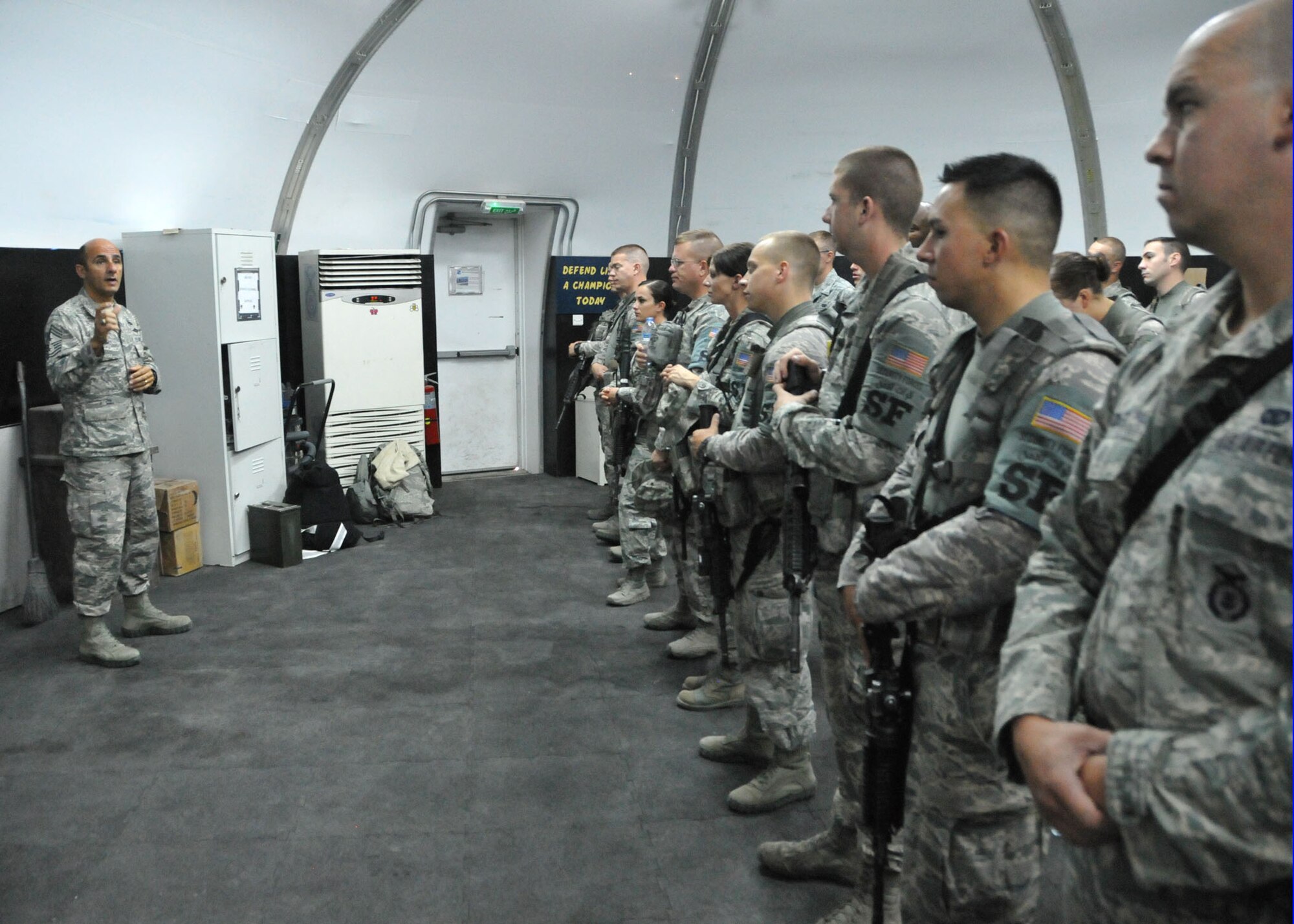 Air Force Command Chief Master Sgt. Samer Alkhoury speaks to members of the 380th Expeditionary Security Forces Squadron during a morning formation at the 380th Air Expeditionary Wing Aug. 3, 2014. (U.S. Air Force photo by Senior Master Sgt. Eric Peterson/Released)
