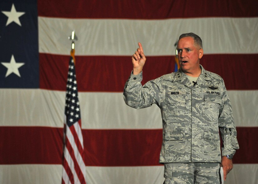 Maj. Gen. Rick Martin, commander of the U.S. Air Force Expeditionary Center, spoke to more than 1,800 service members and civilians during a commander’s call on Aug. 11, 2014, at the 3-Bay Hangar on Grand Forks Air Force Base, N.D. The general emphasized the importance of integrity and upholding Air Force core values, and expressed appreciation for the important mission at the 319th Air Base Wing.  (U.S. Air Force photo/Senior Airman Xavier Navarro)