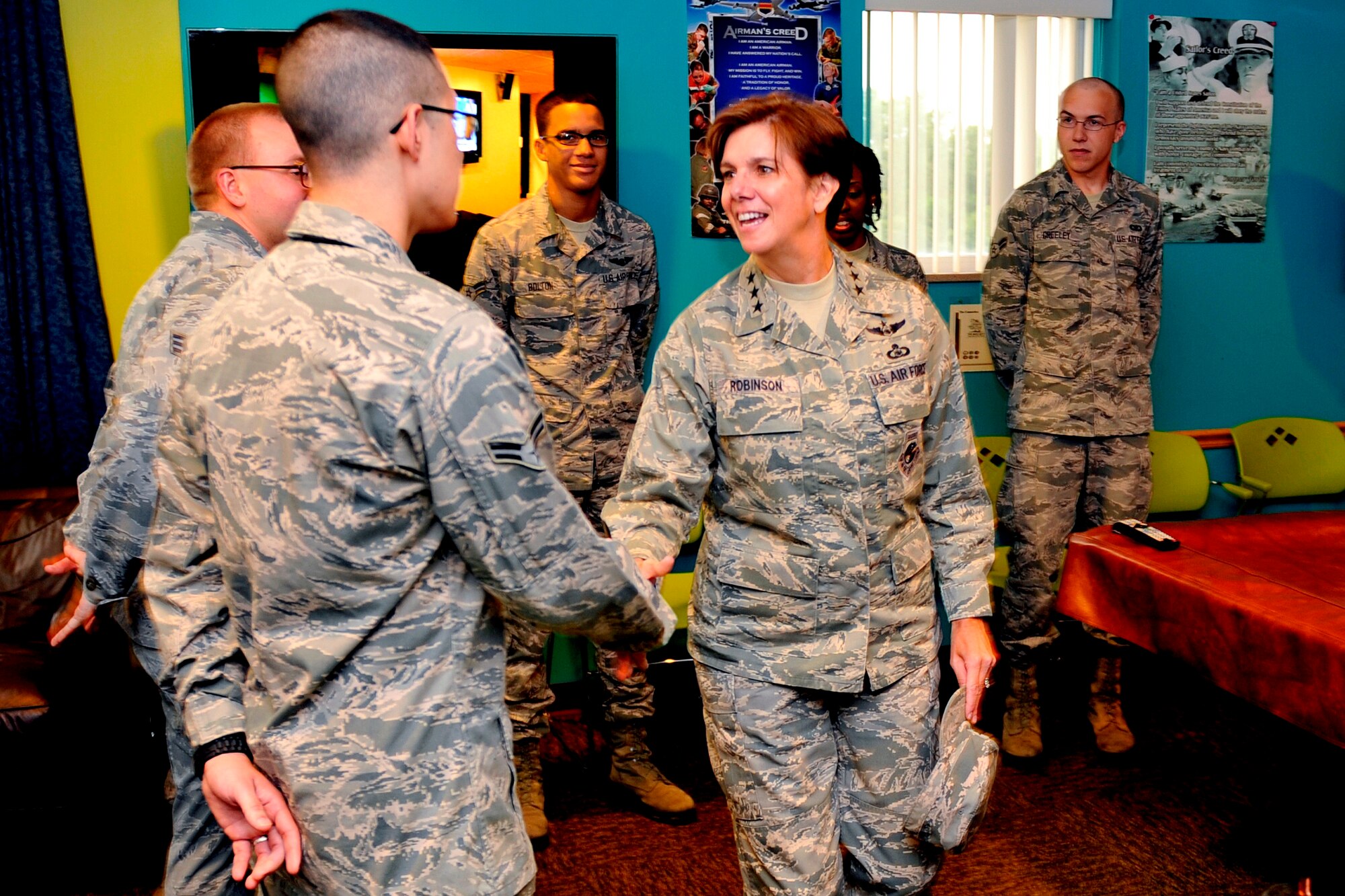 U.S. Air Force Lt. Gen. Lori J. Robinson, vice commander of Air Combat Command, greets Airman 1st Class Jason Beard, 55th Maintenance Group, during her visit to “The Connection” on Offutt Air Force Base, Neb., Aug. 8. The Connection, located inside the Tuskegee Airman Dormitory, is managed by Airmen with the goal of promoting peer-to peer relationships and leadership. (U.S. Air Force photo by Jeff W. Gates/Released)
 
