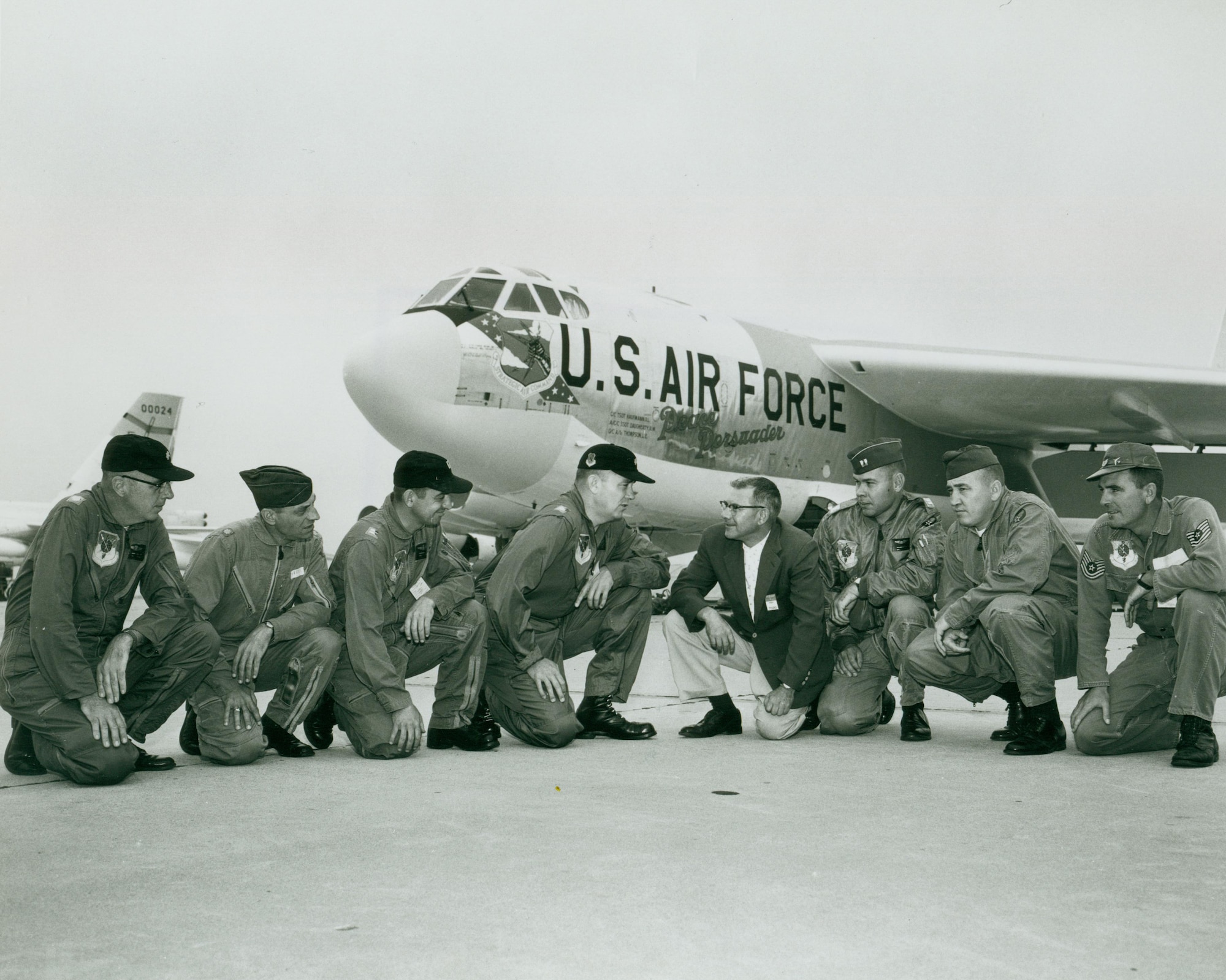 Base leadership and former North Dakota governor, William Guy, kneel in front of the "Peace Persuader" on Minot Air Force Base in July of 1961. This was the first B-52H Stratofortress delivered to the base.  -- Courtesy Photo

