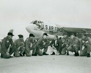 Base leadership and former North Dakota governor, William Guy, kneel in front of the "Peace Persuader" on Minot Air Force Base in July of 1961. This was the first B-52H Stratofortress delivered to the base.  -- Courtesy Photo
