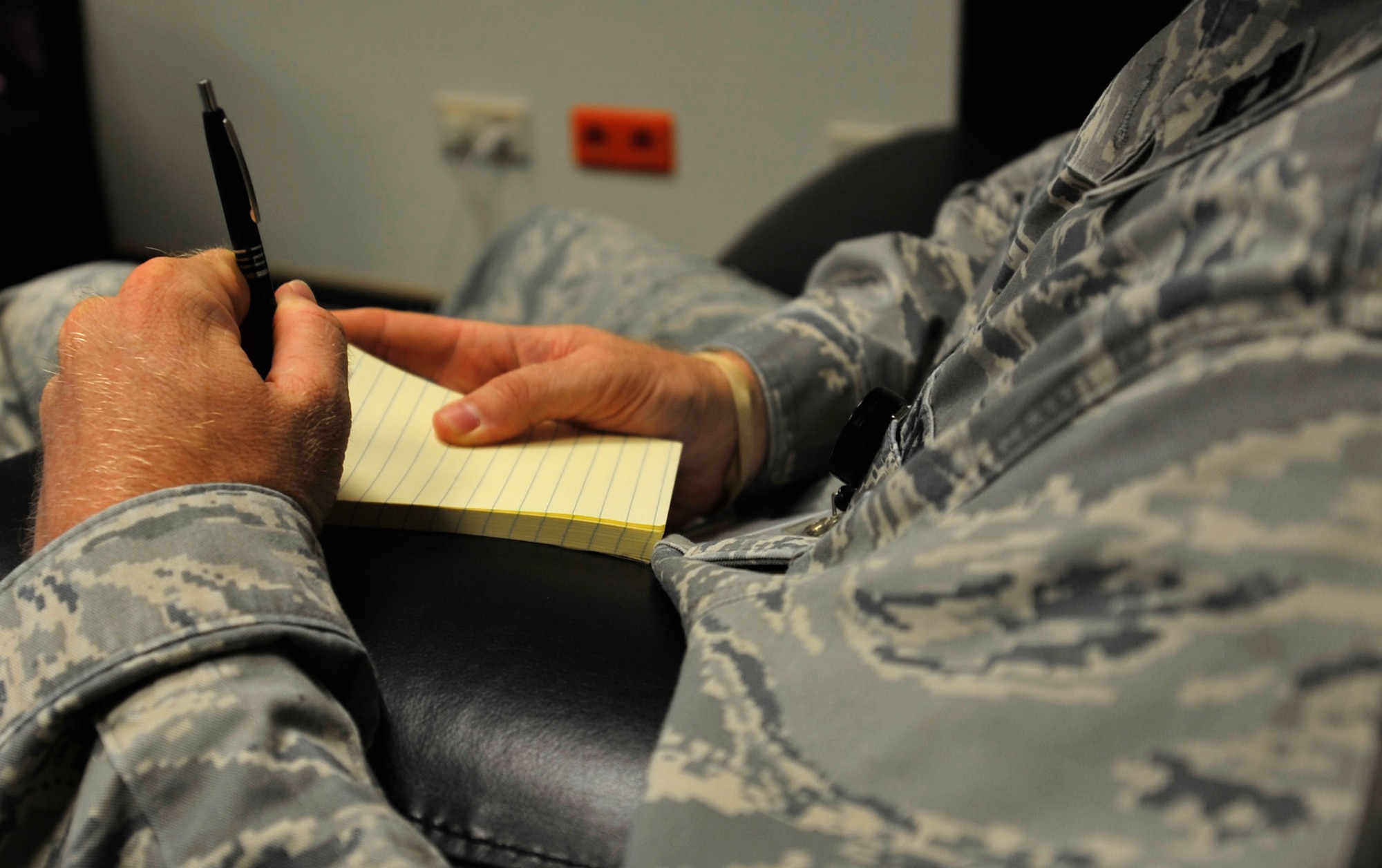 Capt. David Weller, 86th Medical Operations Squadron Alcohol and Drug Abuse Prevention and Treatment program manager, takes notes Aug. 12, 2014, at Ramstein Air Base, Germany. Aug. 13 is “International Left-Hander’s Day”, spreading awareness of the obstacles left-handed people face in a right-handed world. Left-handed Airmen adapt to things made for righties from daily appliances to firearms. (U.S. Air Force photo/Airman Larissa Greatwood)