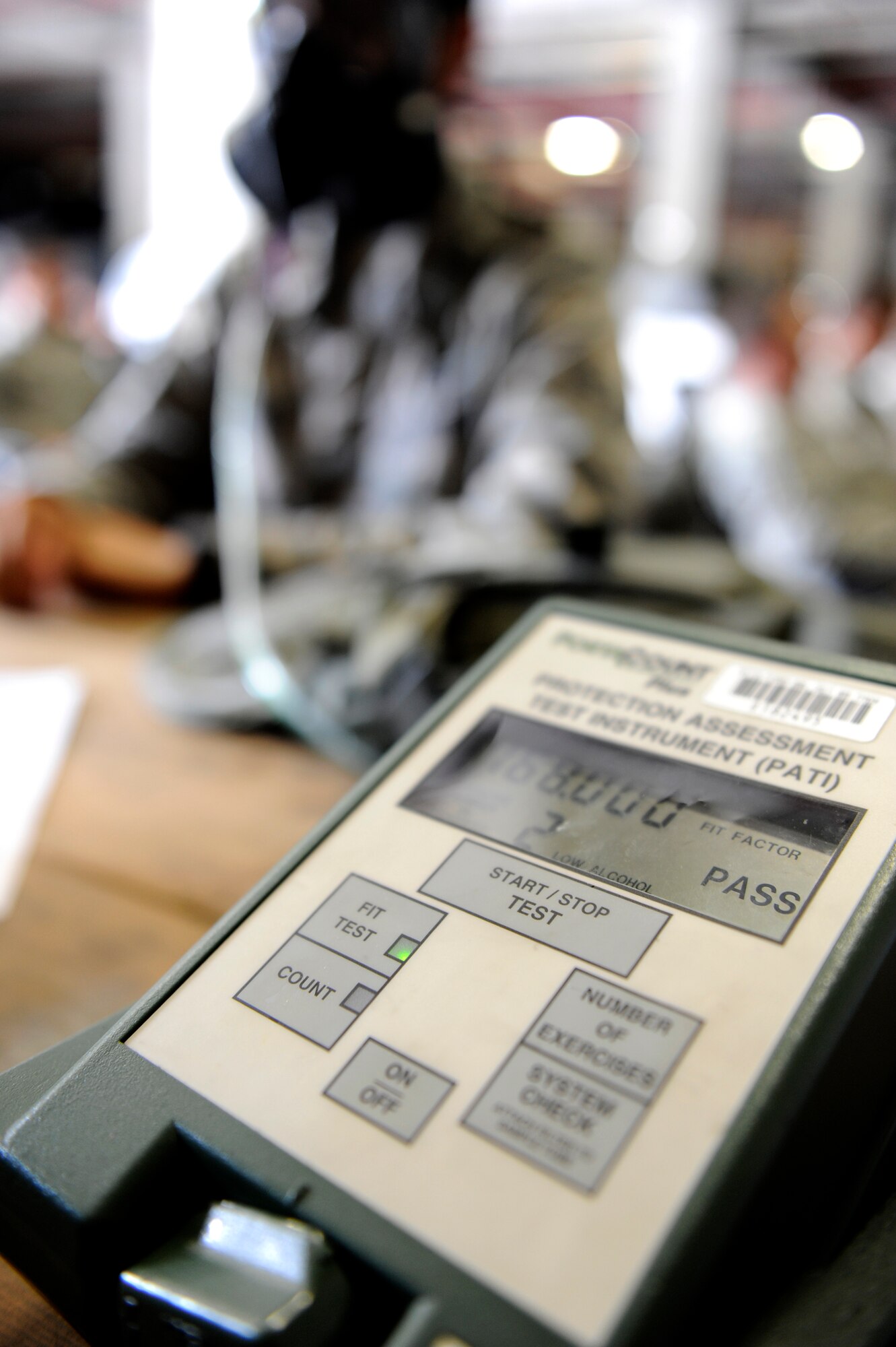 A U.S. Air Force Airman gets a gas mask fit test after receiving his individual protective equipment on Kadena Air Base, Japan, Aug. 13, 2014. Prior to mission focused exercises, Airmen are reminded to inspect and clean all components of their mission oriented protective posture gear. (U.S. Air Force photo by Senior Airman Maeson L. Elleman/Released)