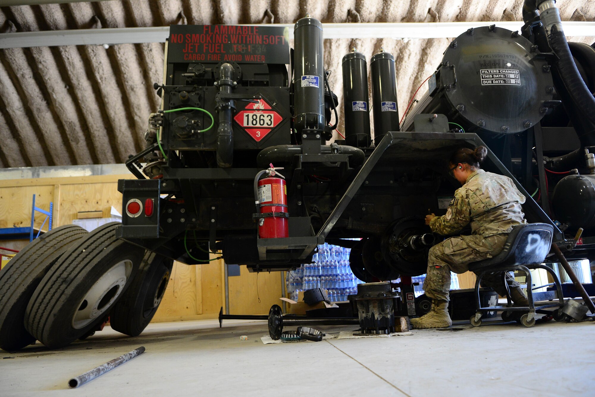 U.S. Air Force Senior Airman Saber Barrera, 455th Expeditionary Logistics Readiness Squadron fire truck and refueling mechanic, repairs a fuel truck axel at Bagram Airfield, Afghanistan Aug. 7, 2014. The refueling maintenance shop provides support on all vehicles dealing with gasoline pumping operations.  The shop works with aircraft squadrons and the Petroleum, Oil and Lubricants flight shops to keep aircraft fueled.  Barrera is deployed from Nellis Air Force Base, Nev.  and a native of Anchorage, Alaska. (U.S. Air Force photo by Staff Sgt. Evelyn Chavez/Released)