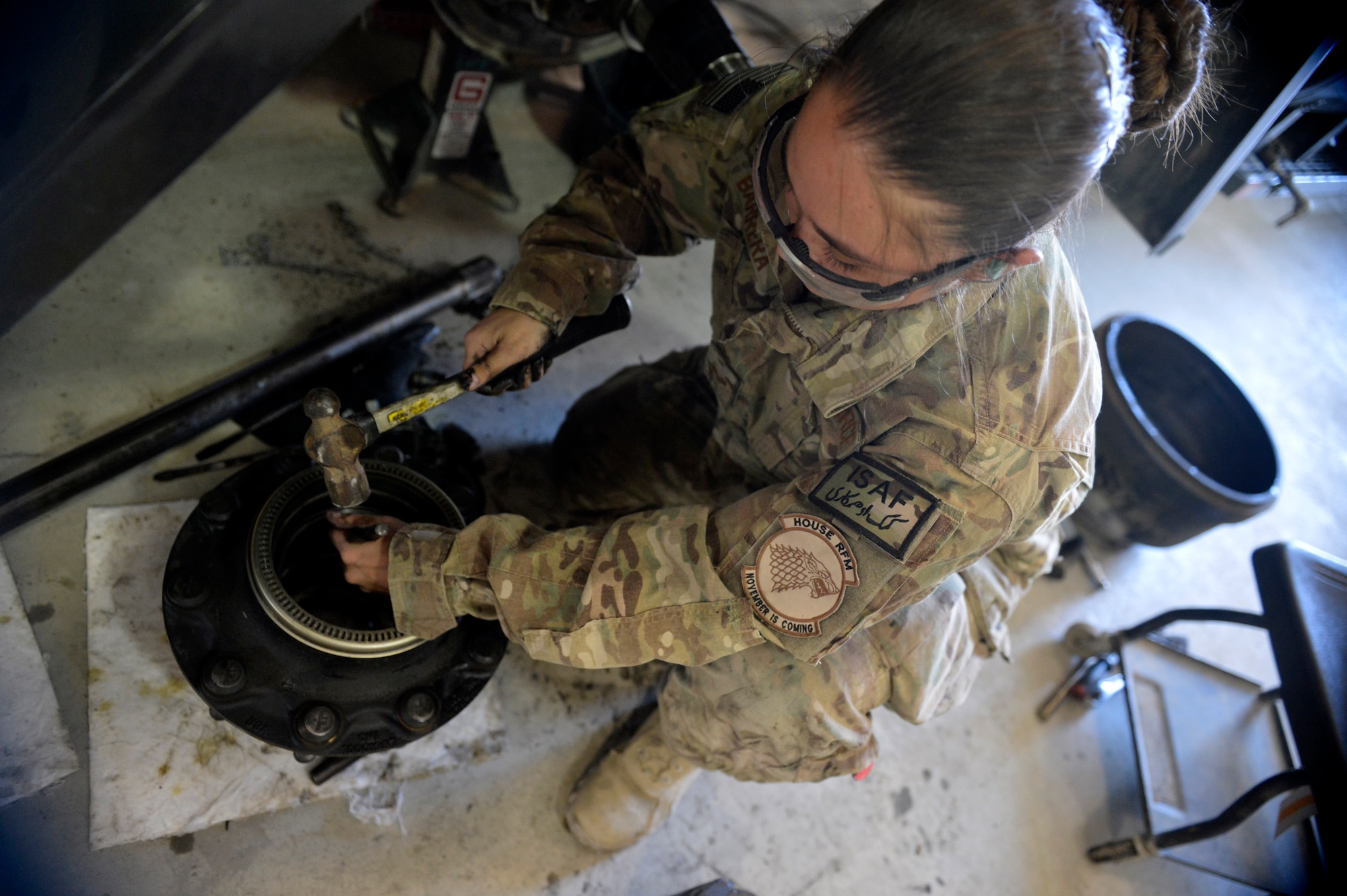U.S. Air Force Senior Airman Saber Barrera, 455th Expeditionary Logistics Readiness Squadron fire truck and refueling mechanic, repairs a fuel truck at Bagram Airfield, Afghanistan Aug. 7, 2014.  The refueling maintenance shop provides support on all vehicles dealing with gasoline pumping operations.  The shop works with aircraft squadrons and the Petroleum, Oil and Lubricants flight shops to keep aircraft refueled.  Barrera is deployed from Nellis Air Force Base, Nev.  and a native of Anchorage, Alaska. (U.S. Air Force photo by Staff Sgt. Evelyn Chavez/Released)