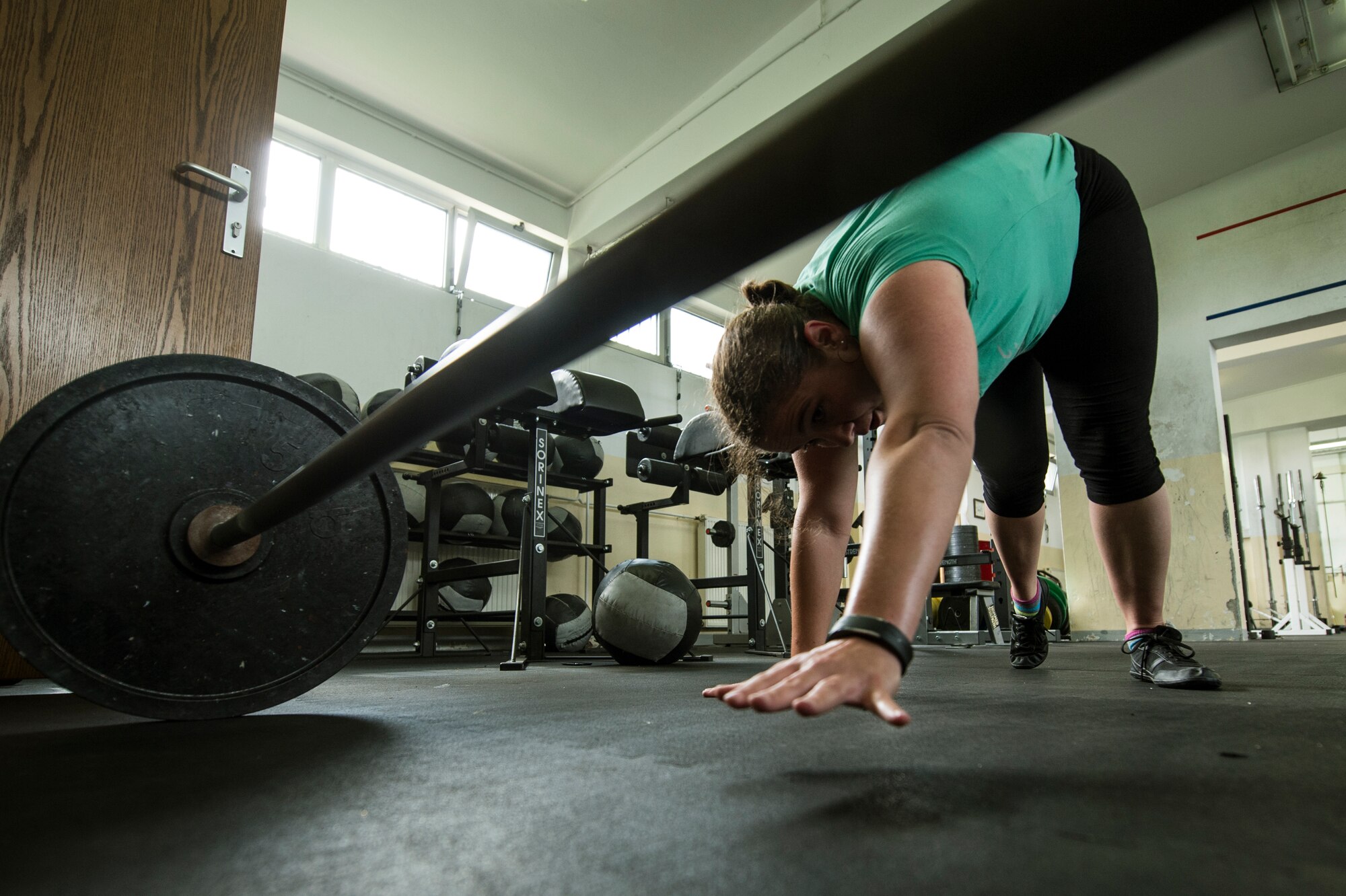 U.S. Air Force Staff Sgt. India Smith, 372nd Training Squadron Detachment 17 NCO in charge of knowledge operations from Ottawa, Kan., works out Aug. 8, 2014, at Spangdahlem Air Base, Germany. Since starting to workout consistently, Smith believes she will score in the excellent category on her next physical fitness test. (U.S. Air Force photo by Senior Airman Rusty Frank/Released)