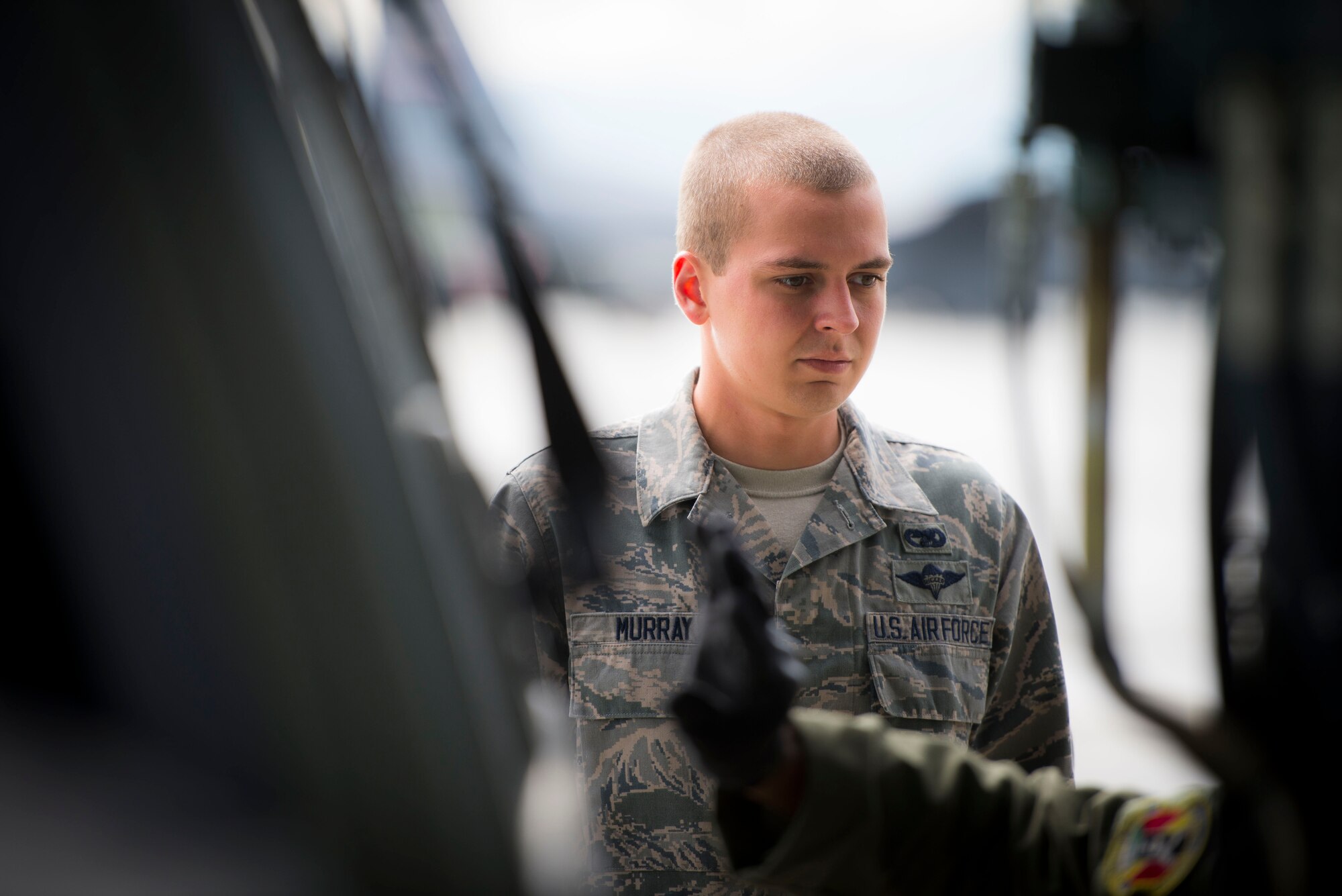 Airman 1st Class Chris Murray, a rigger with the 374th Logistics Readiness Squadron's Combat Mobility Flight, assists a fork lift driver while loading cargo on to a C-130 Hercules during Exercise RED FLAG-Alaska on Aug. 13, 2014, Joint Base Elmendorf-Richardson, Alaska. RED FLAG provides joint offensive counter-air, interdiction, close air support, and large force employment training in a simulated combat environment. (U.S. Air Force photo by Staff Sgt. Chad C. Strohmeyer/Released)